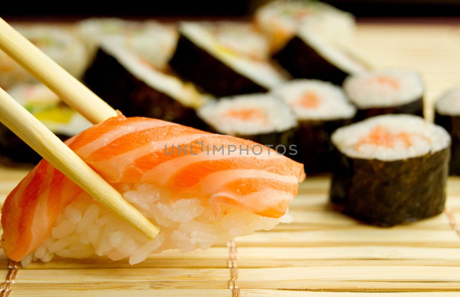 Japanese sushi. Tuna, sticks on bamboo napkin by simpson33
