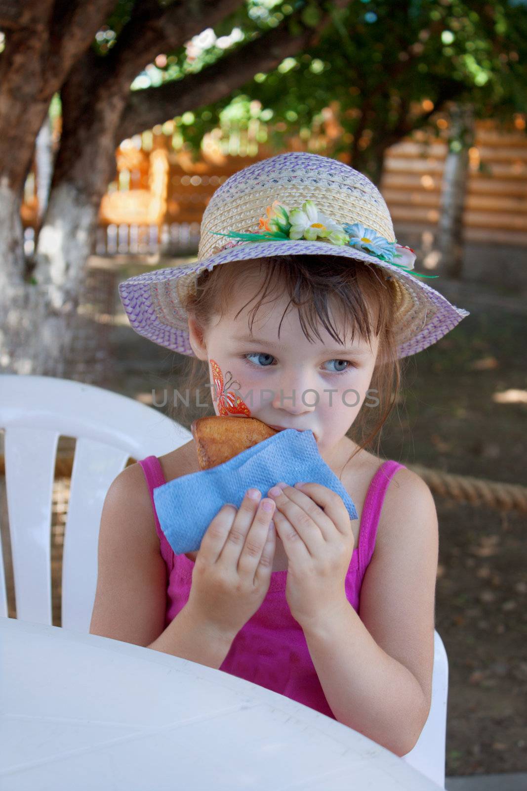 The little girl was hungry, having fun in the park