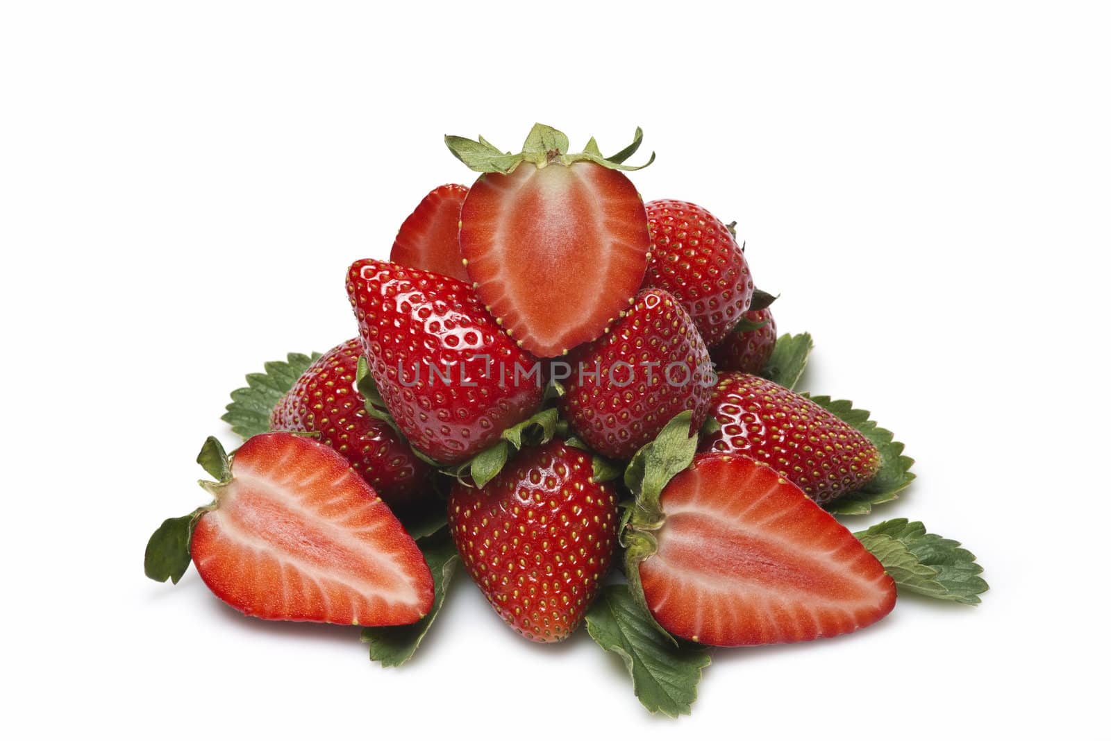 Strawberries with their leaves isolated on a white background