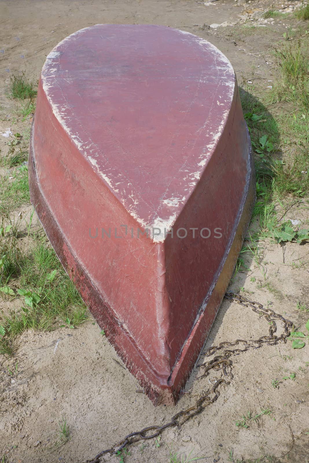 The old boat upside down on the waterfront