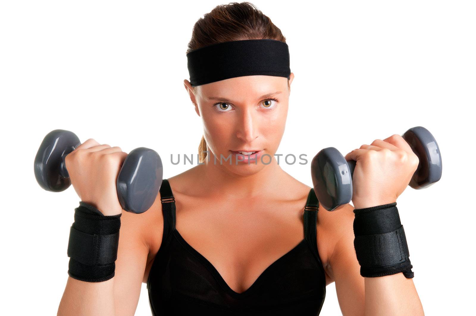 Woman working out with dumbbells at a gym