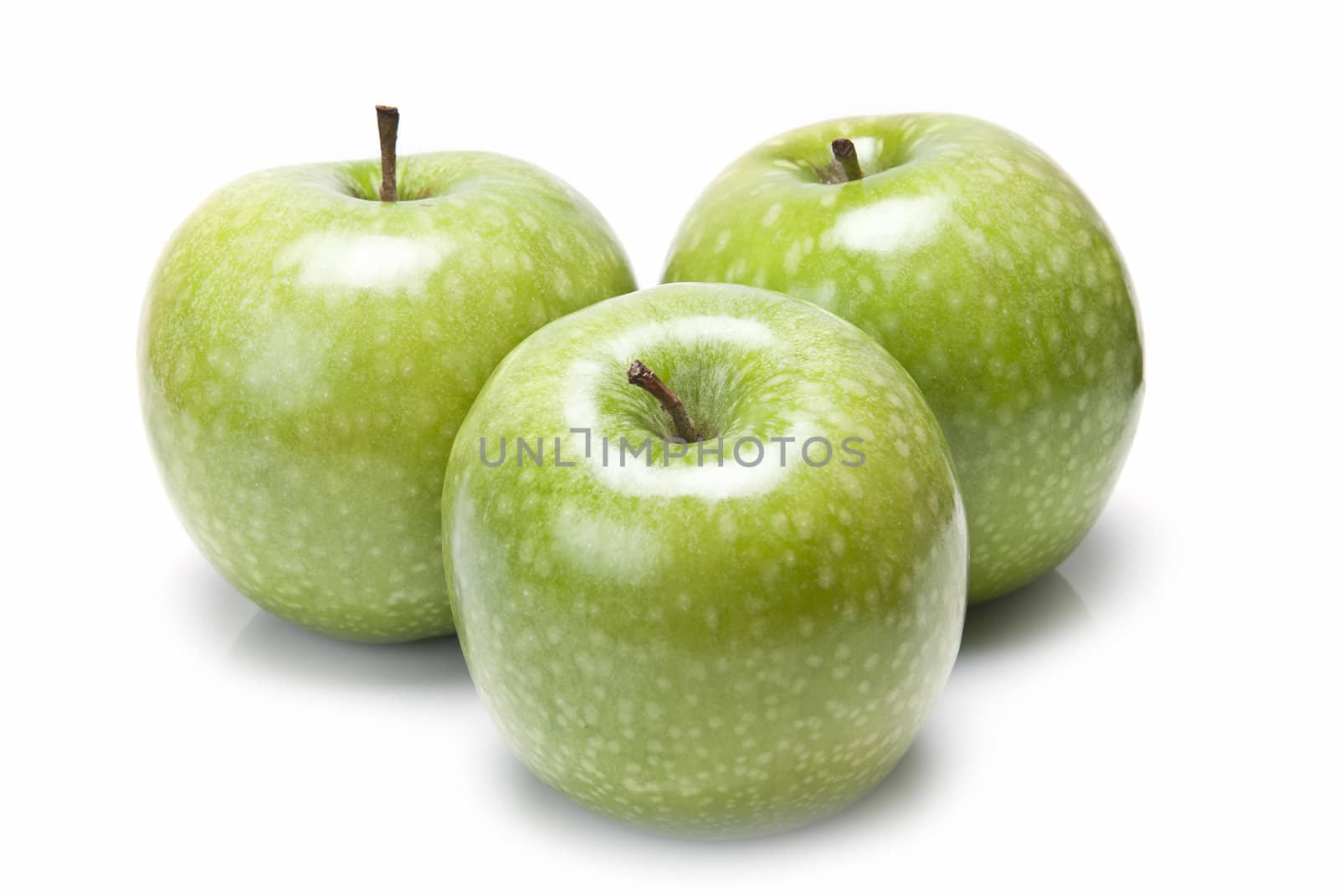 Fresh smith apples  isolated over a white background.