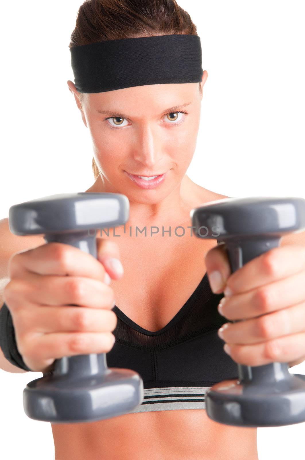 Woman working out with dumbbells at a gym