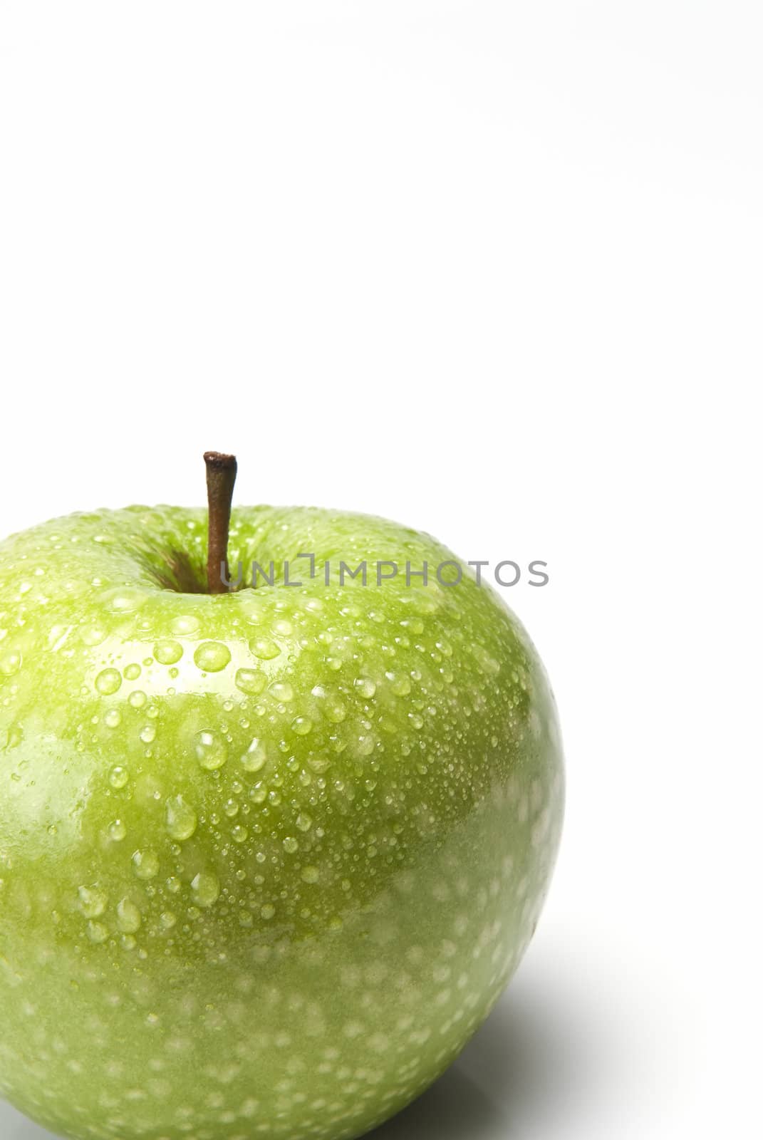 Apple covered with dew droplets. by angelsimon