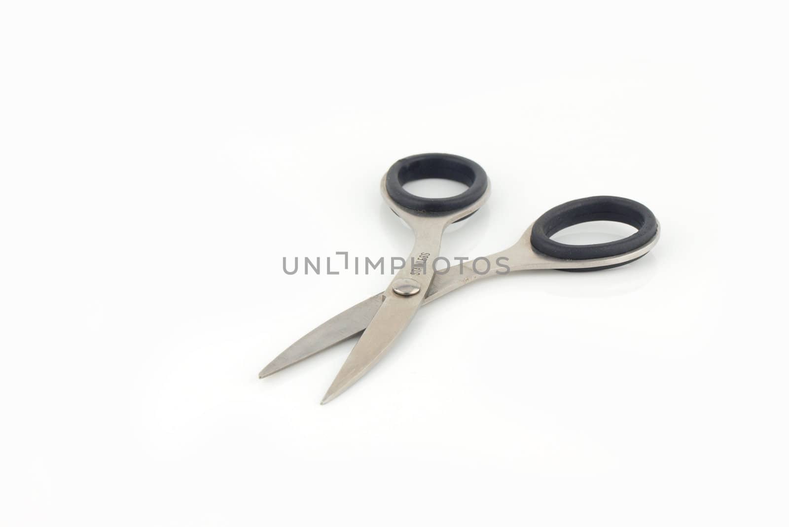 Stainless steel scissors on isolated white background.