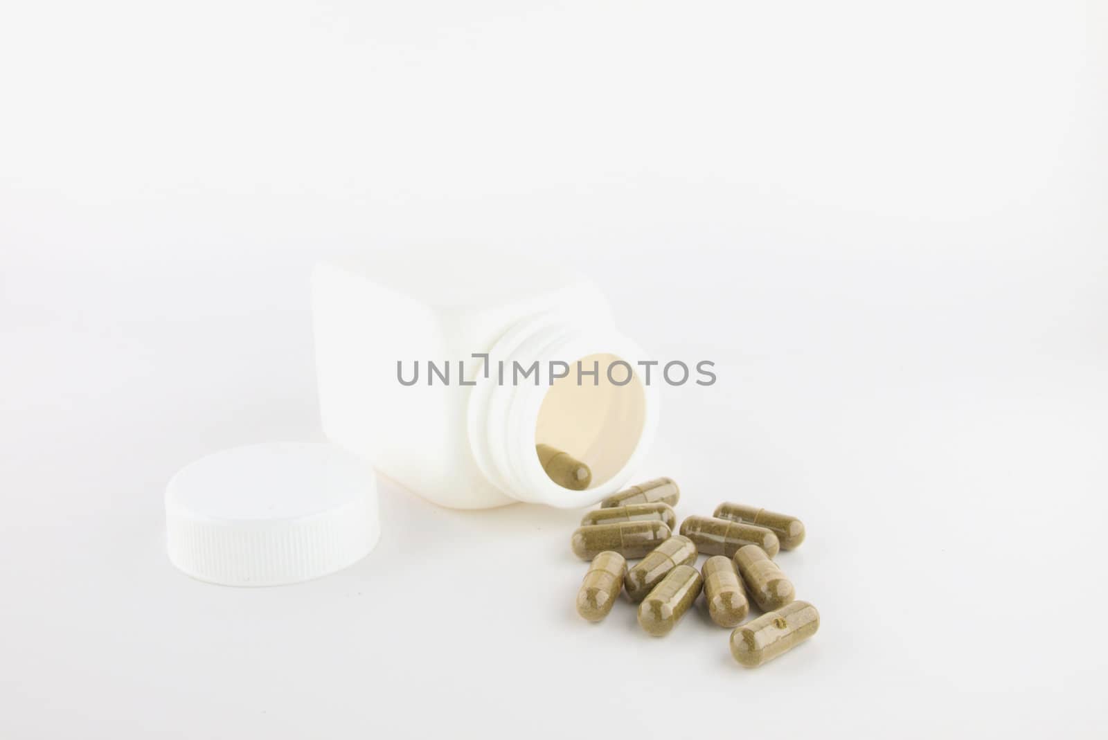 Herbal pill and white bottle ,Isolate on white
