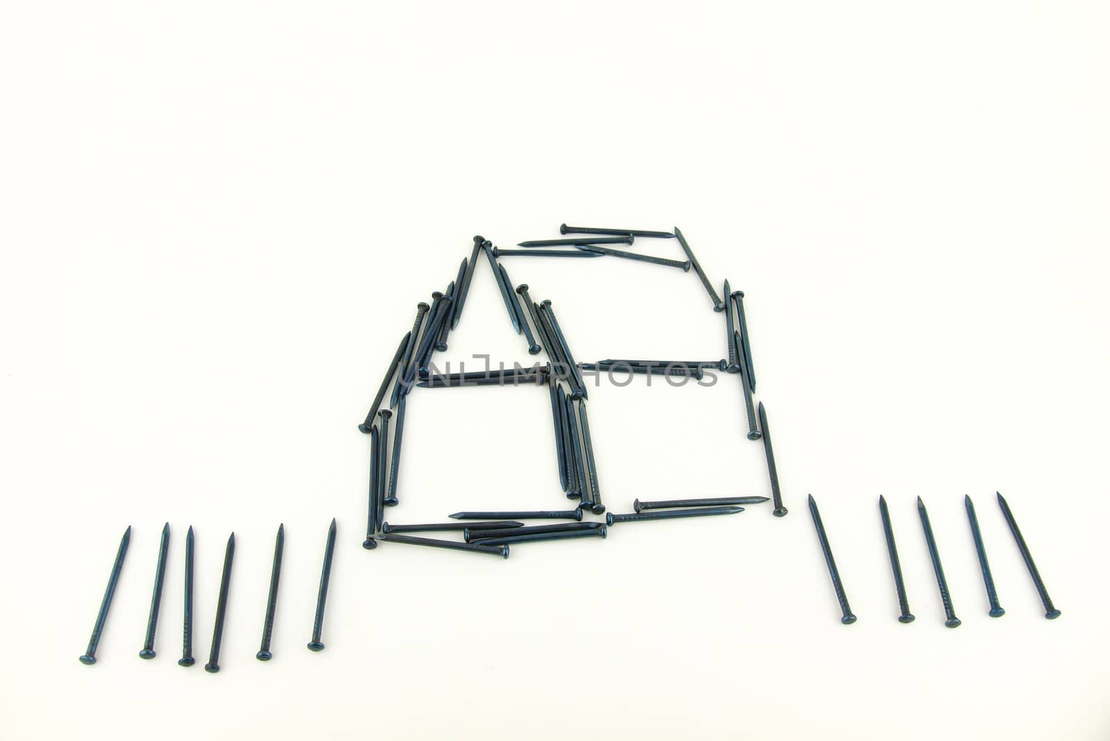 steel nails construct house with fence  by jakgree