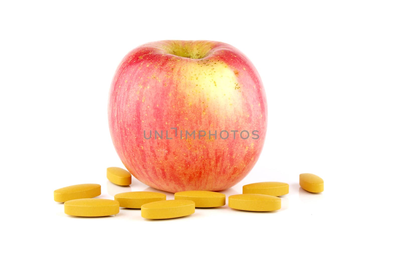 apple with vitamin C on white background  