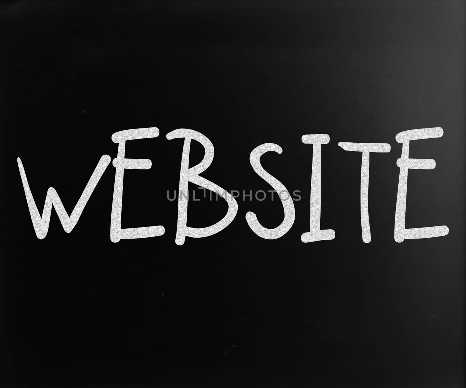 "Website" handwritten with white chalk on a blackboard