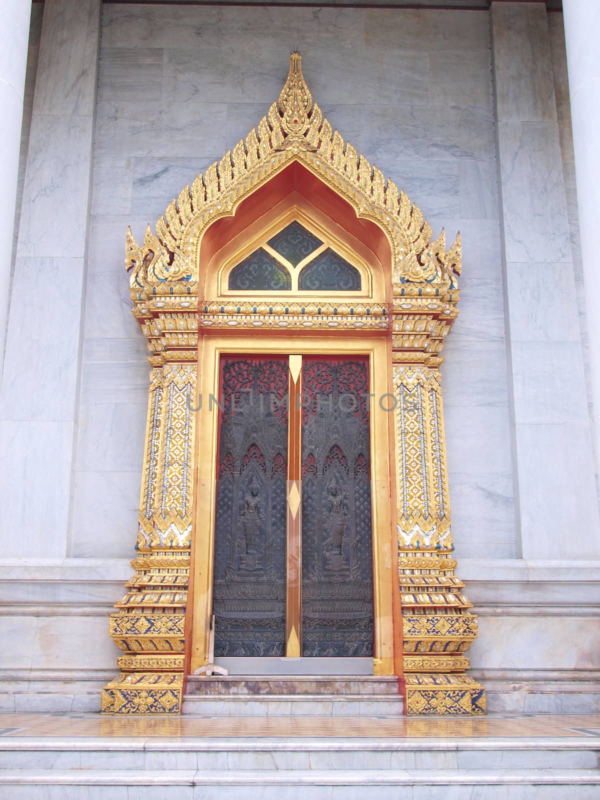 Vintage traditional Thai style door in marble temple by jakgree