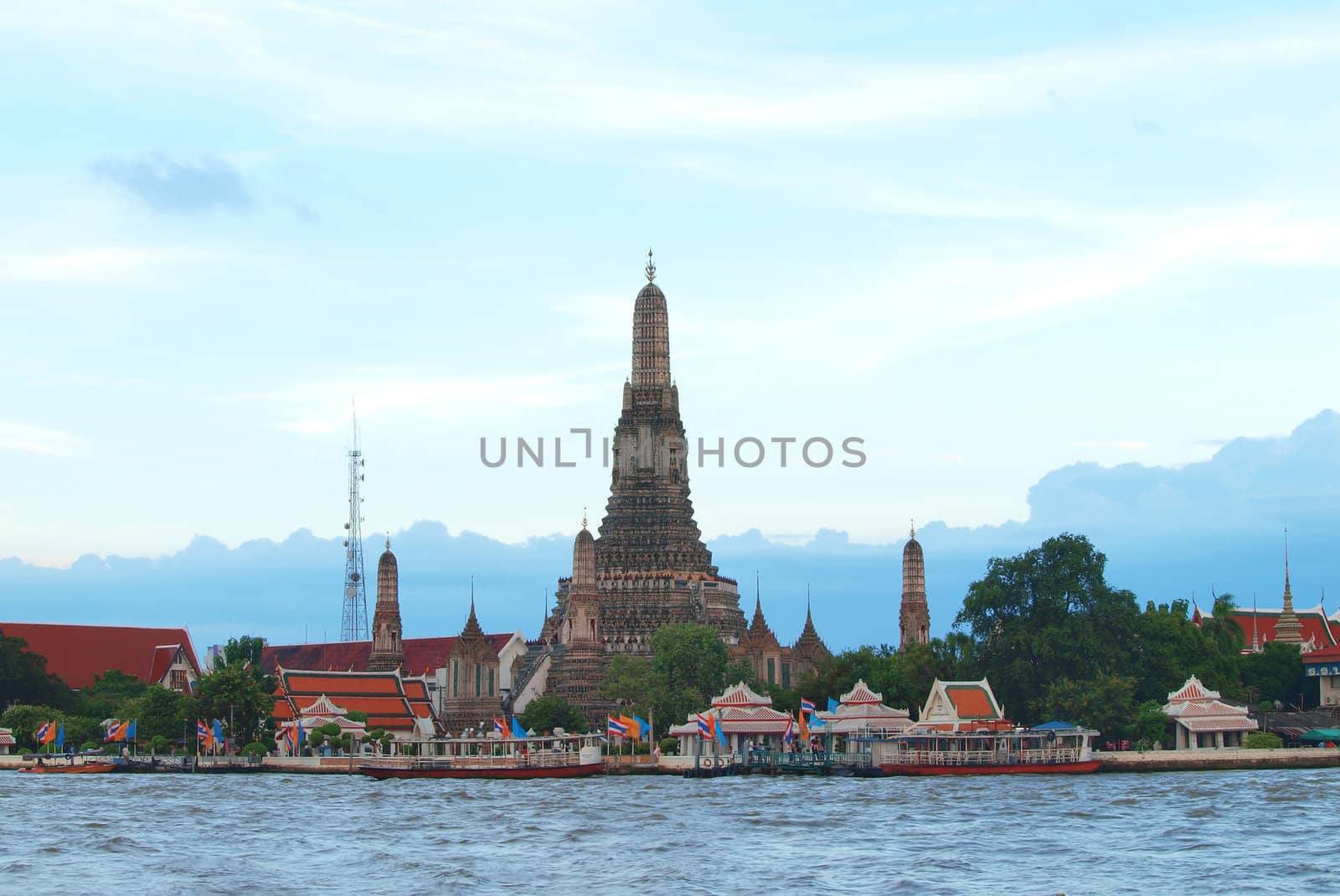 Wat Arun temple in Bangkok on the shore of the Chao Phraya river by jakgree