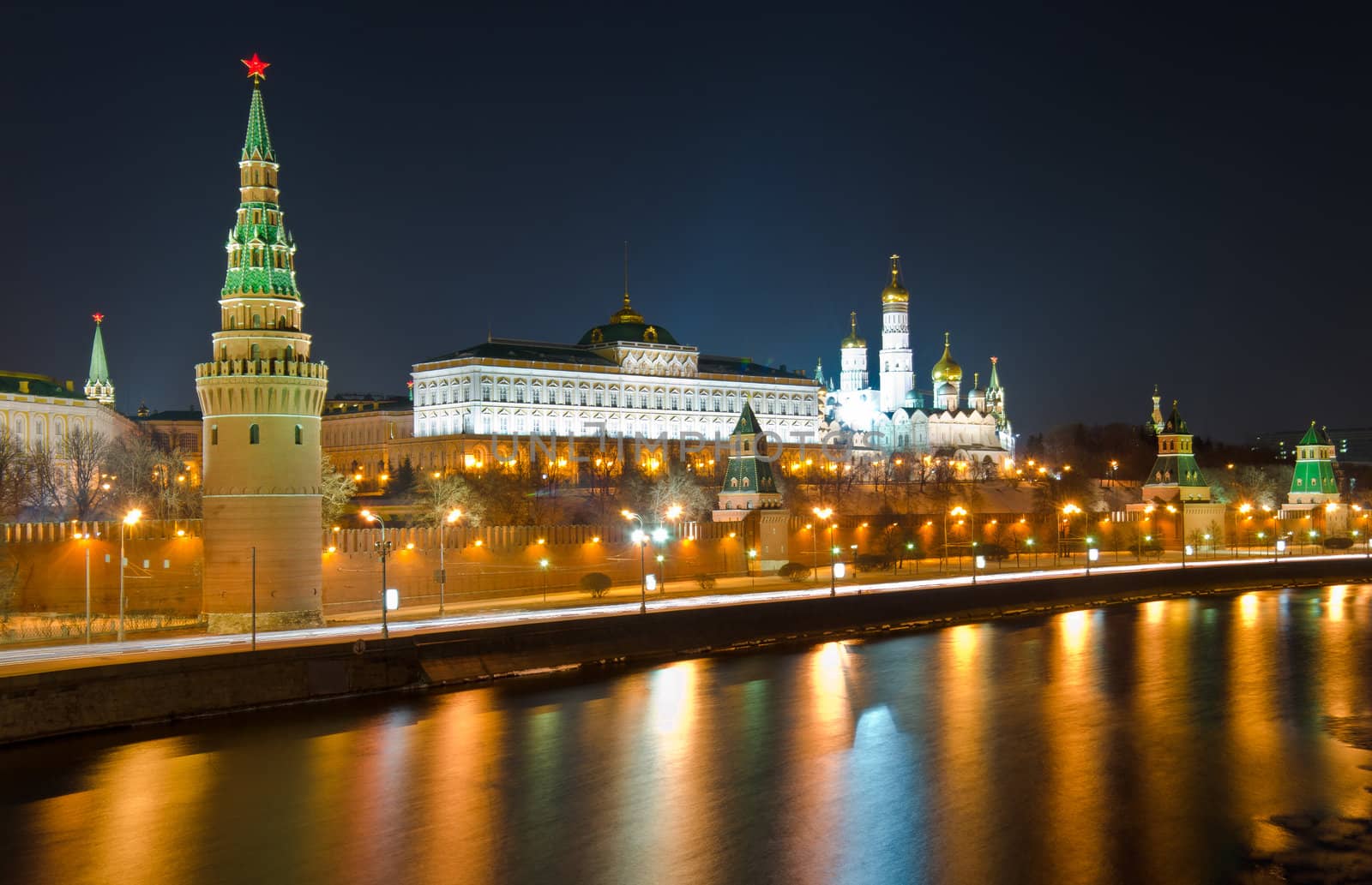 Kind to the Moscow Kremlin and Moskva River in winter night. Russia