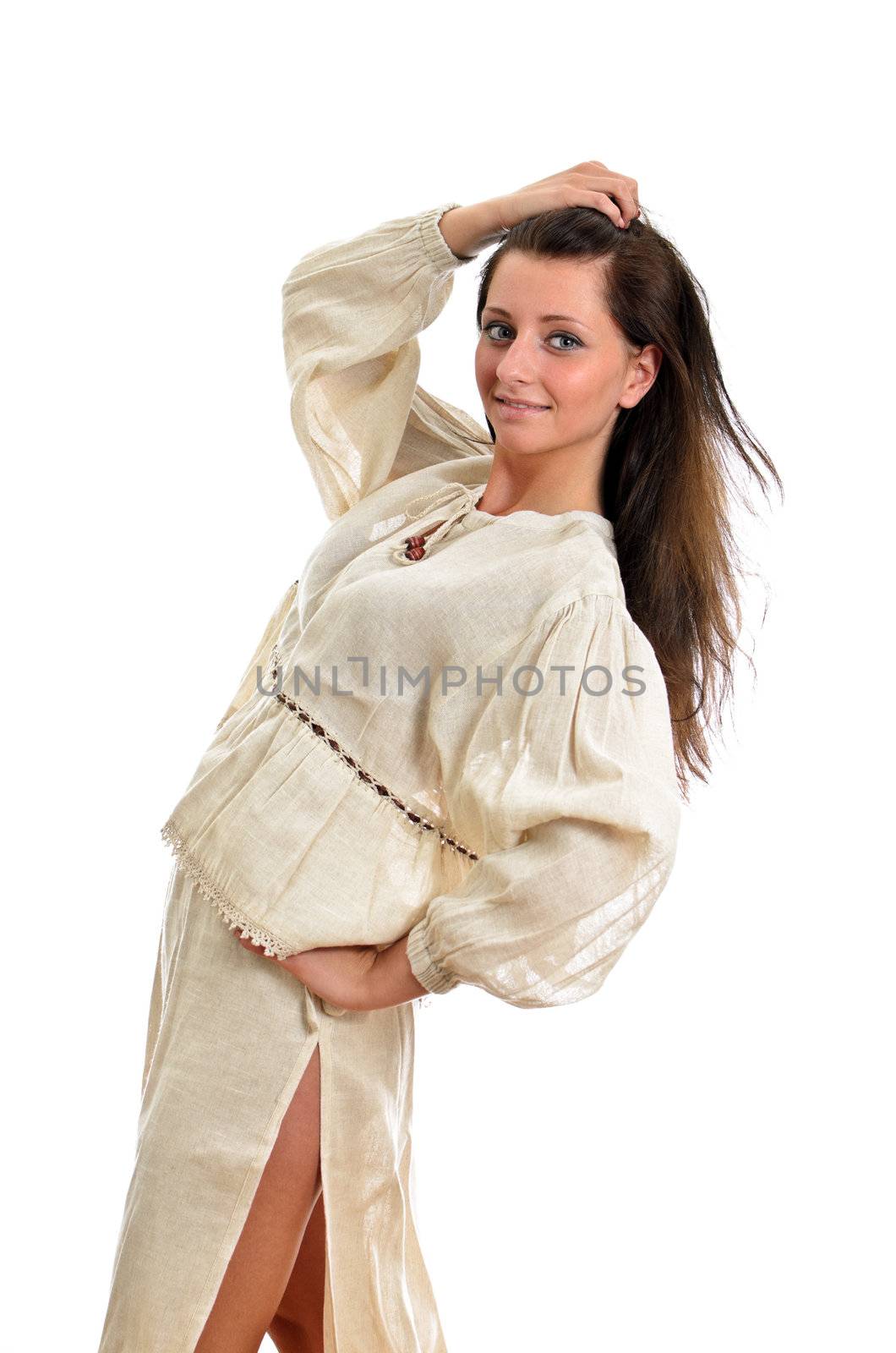 Female in national traditional costume posing. Isolated on white.