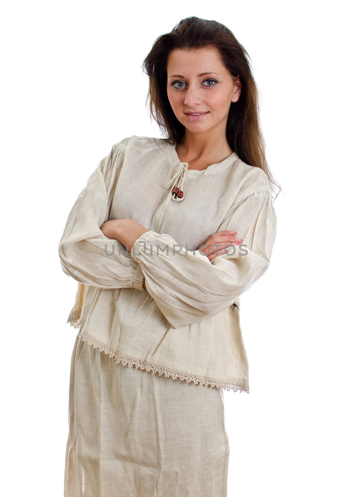 Female in national traditional costume with arms folded. Isolated on white.