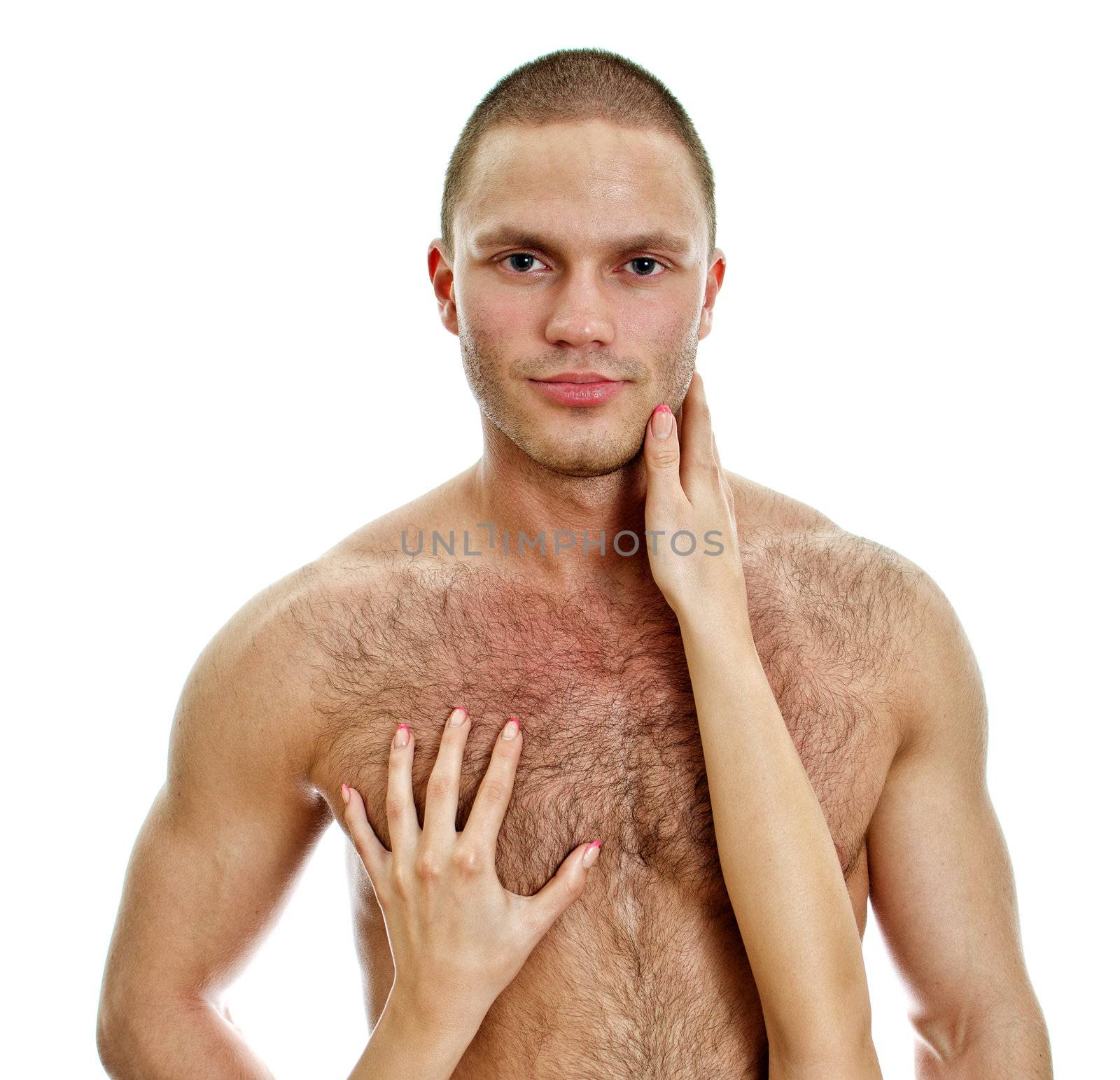 Woman's hands touching man's chest. Isolated on white.