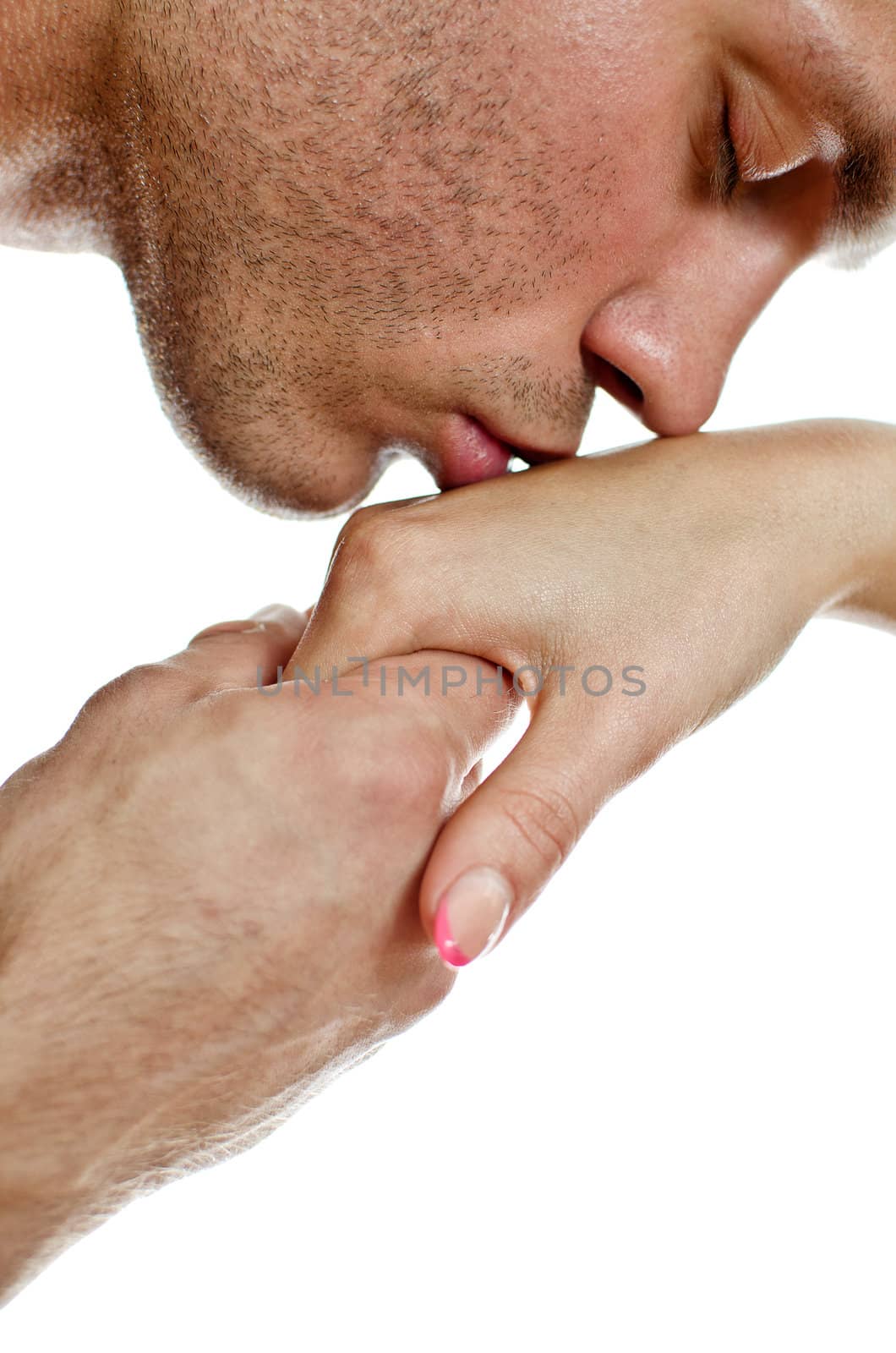 Man kissing woman's hand. Isolated on white. by dmitrimaruta