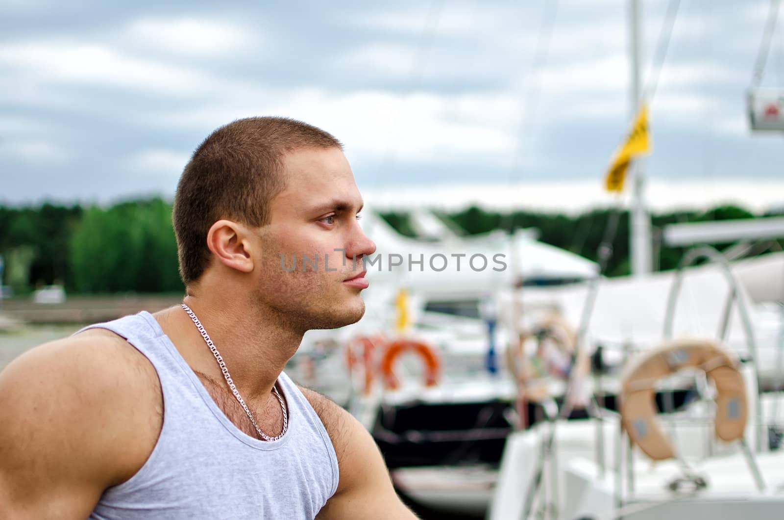 Portrait of attractive male against yachts.
