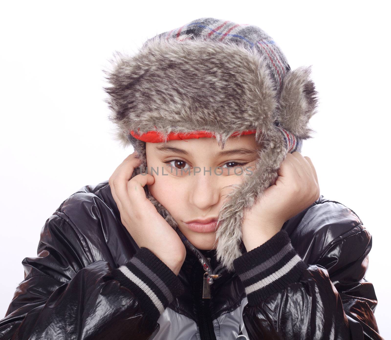 Portrait of bored boy with winter hat