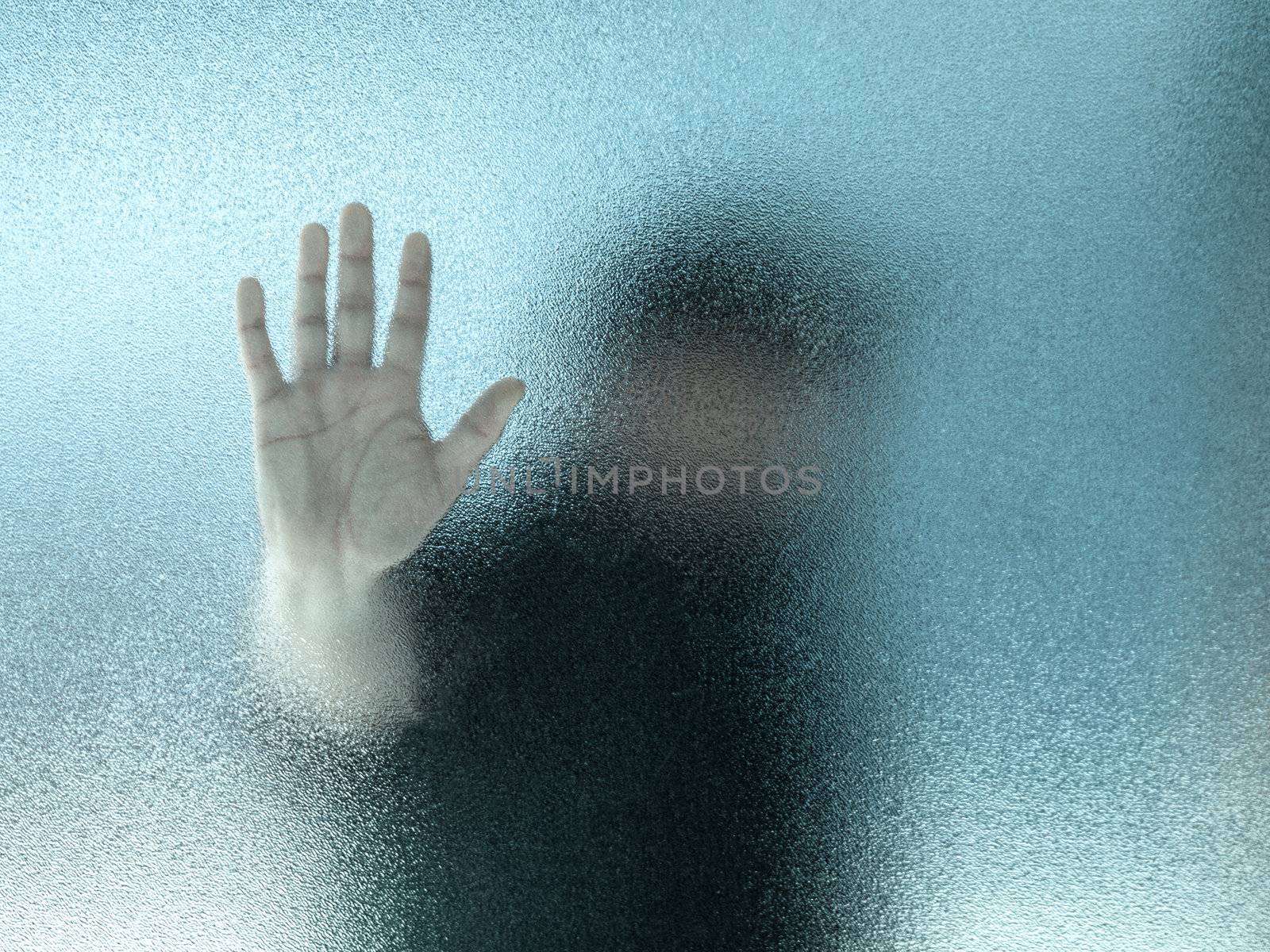 Silhouette of a man through frosted glass