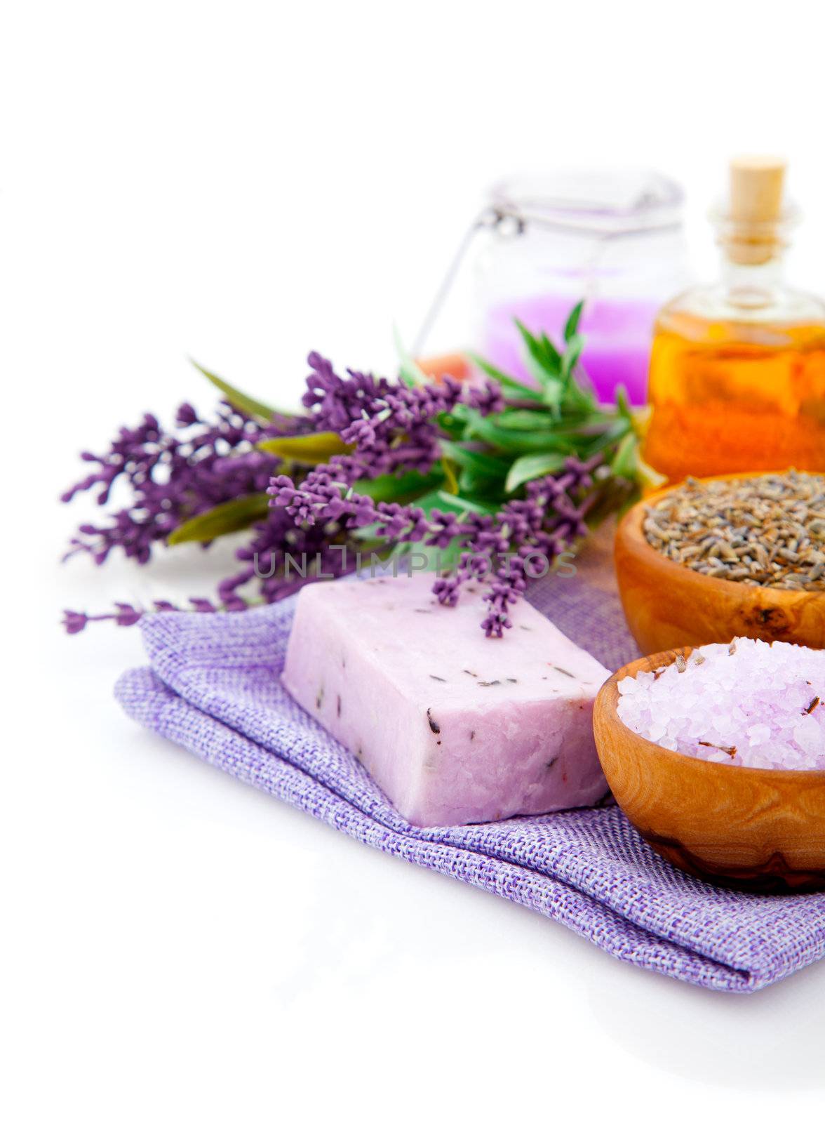 Spa treatment. Lavender bath salt, soap, oil and lavender flower, isolated on white background