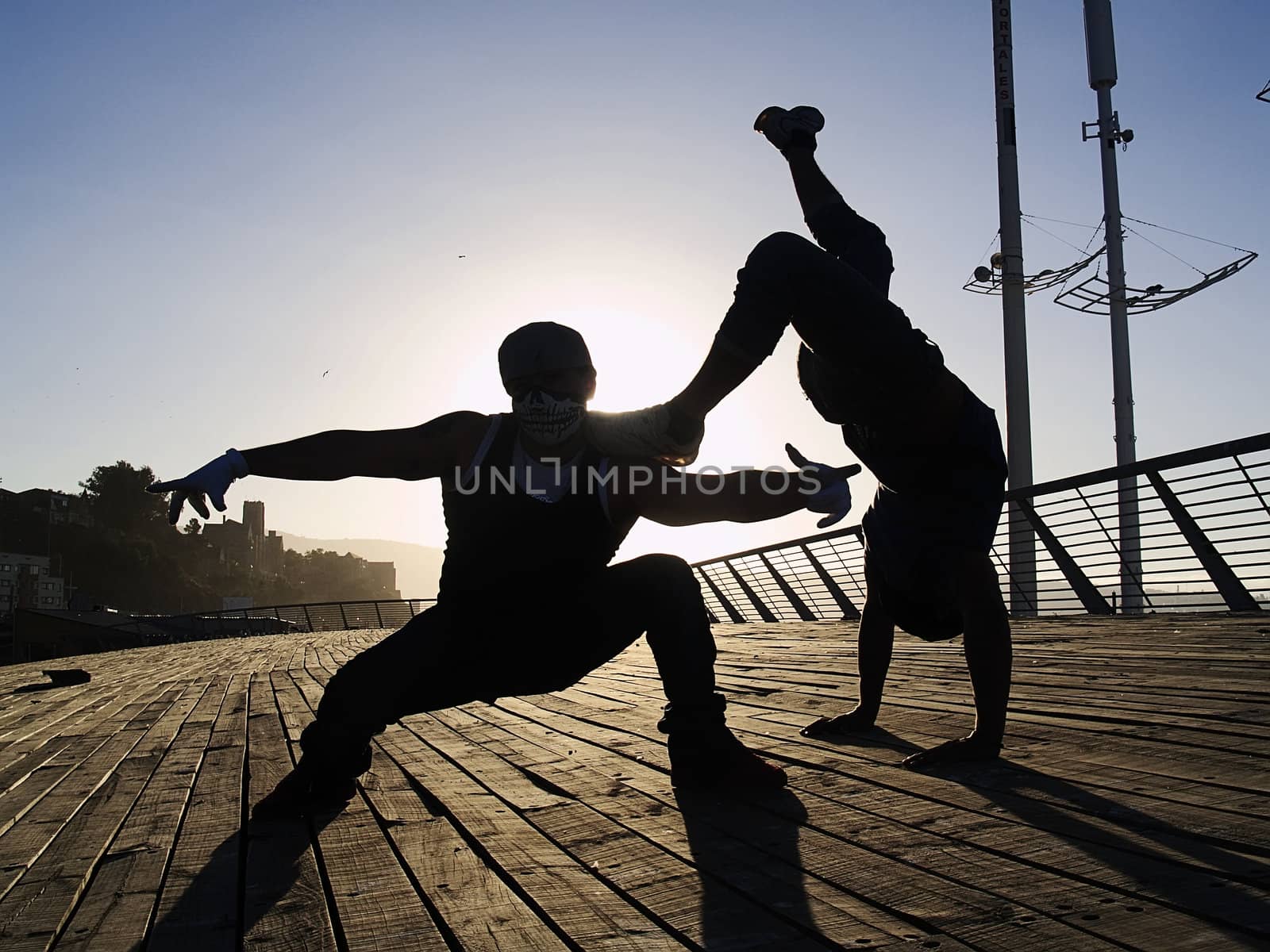 Silhouettes of poses of two rappers