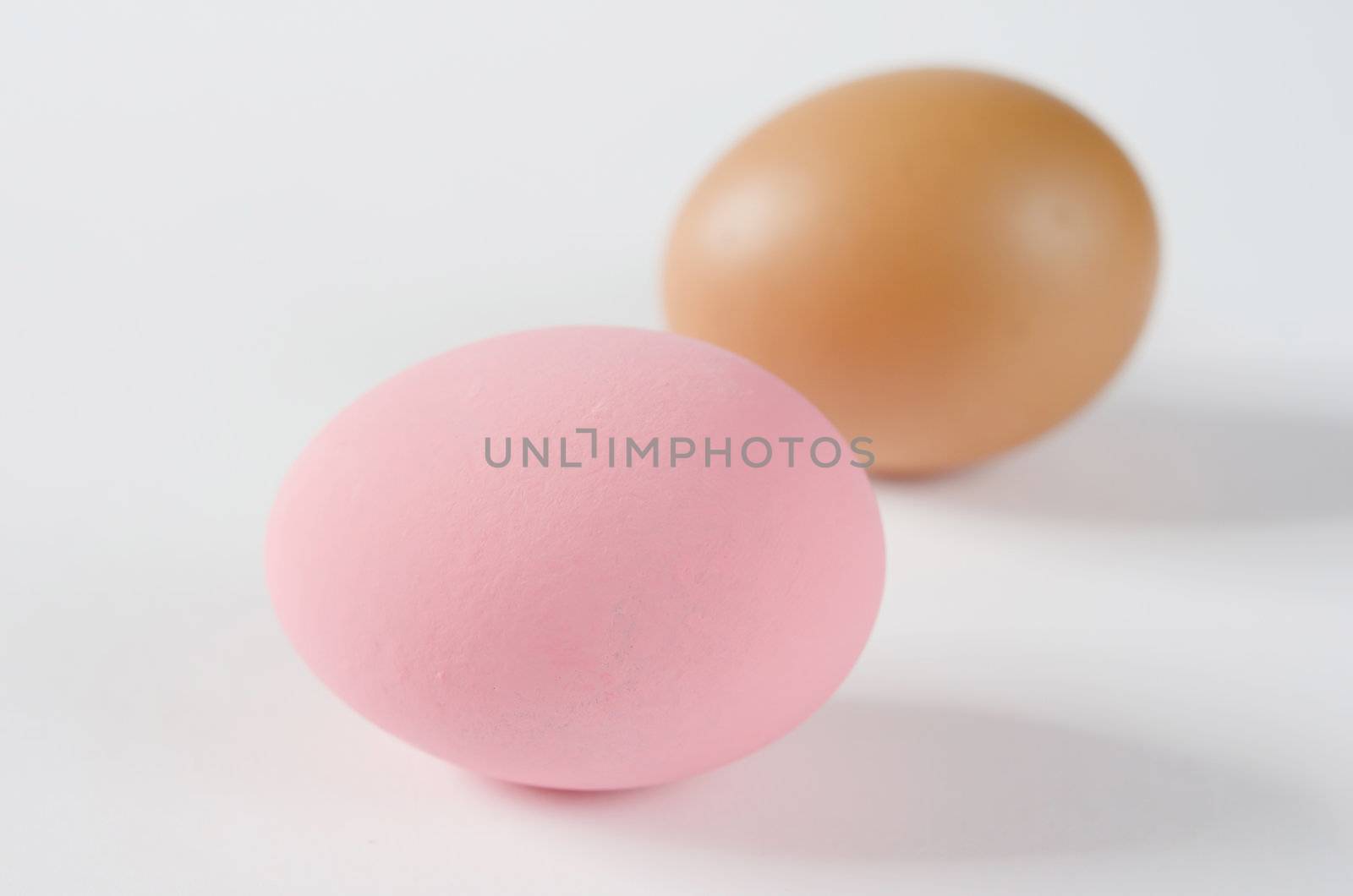 Preserved egg , pink eggs  and  brown eggs on white background