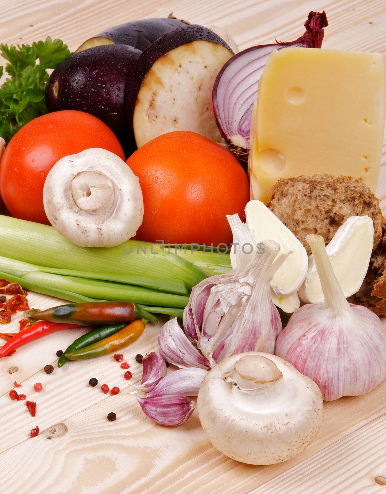 Ingredients and Vegetables with Cheese and Spices closeup on wooden background