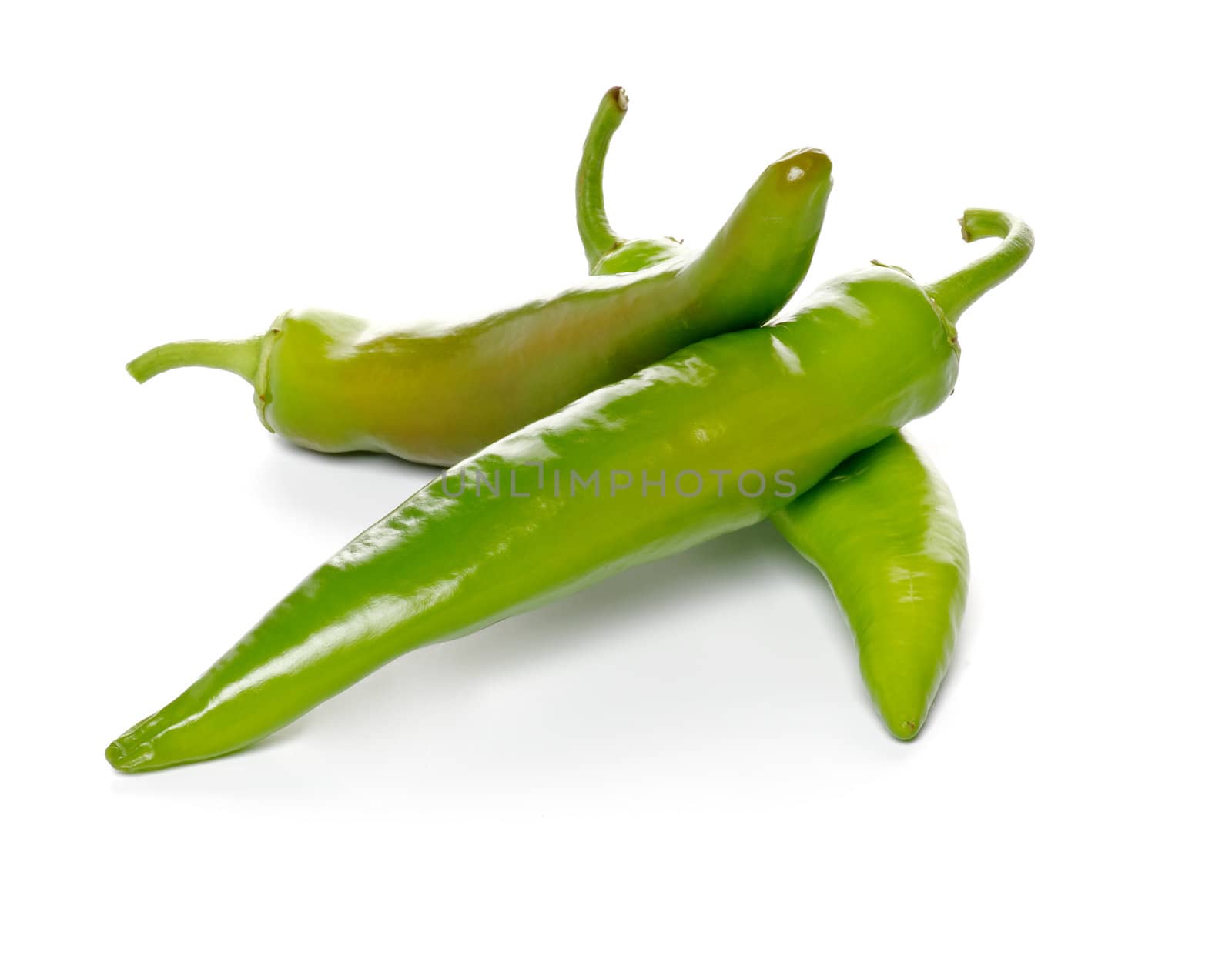 Three green Chili peppers isolated on white background