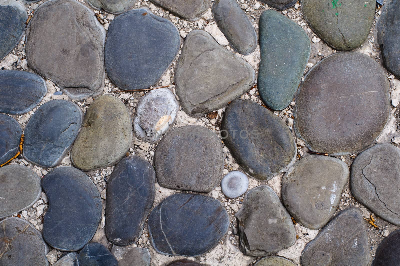 Close up of cobblestones background. High resolution texture