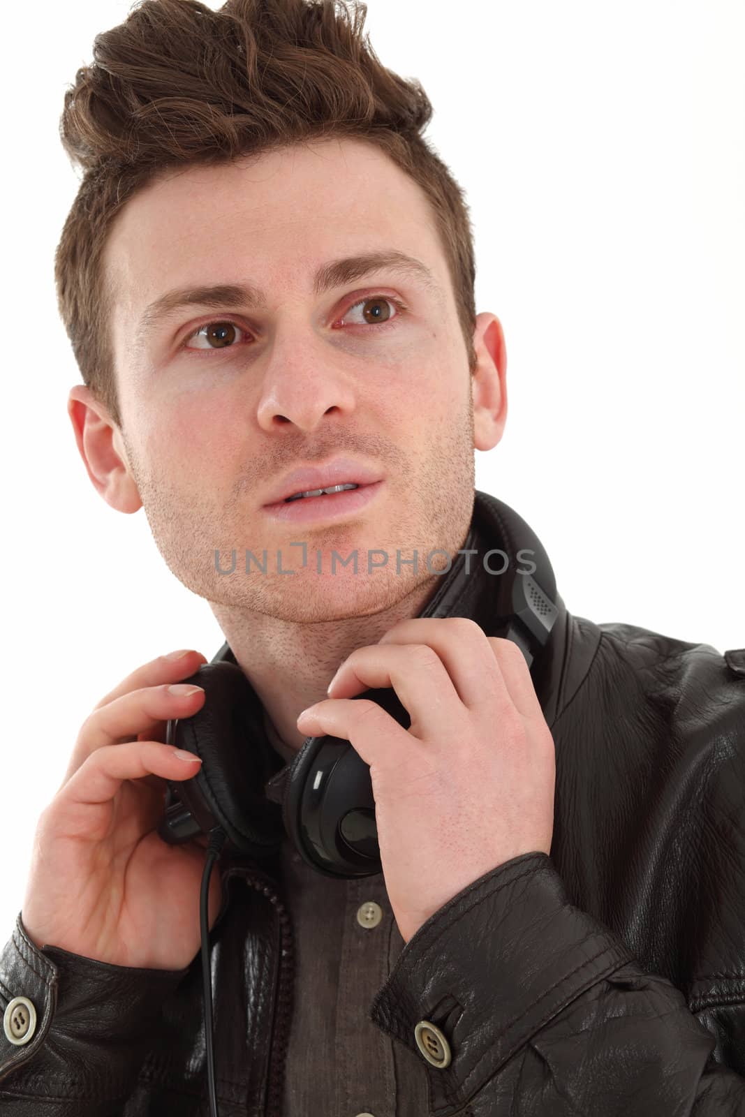 Young adult male with headset listening music isolated on white background