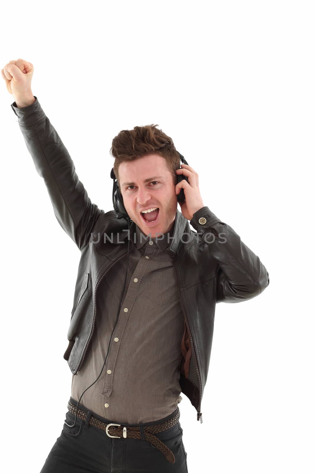 Young adult male with headset listening music isolated on white background