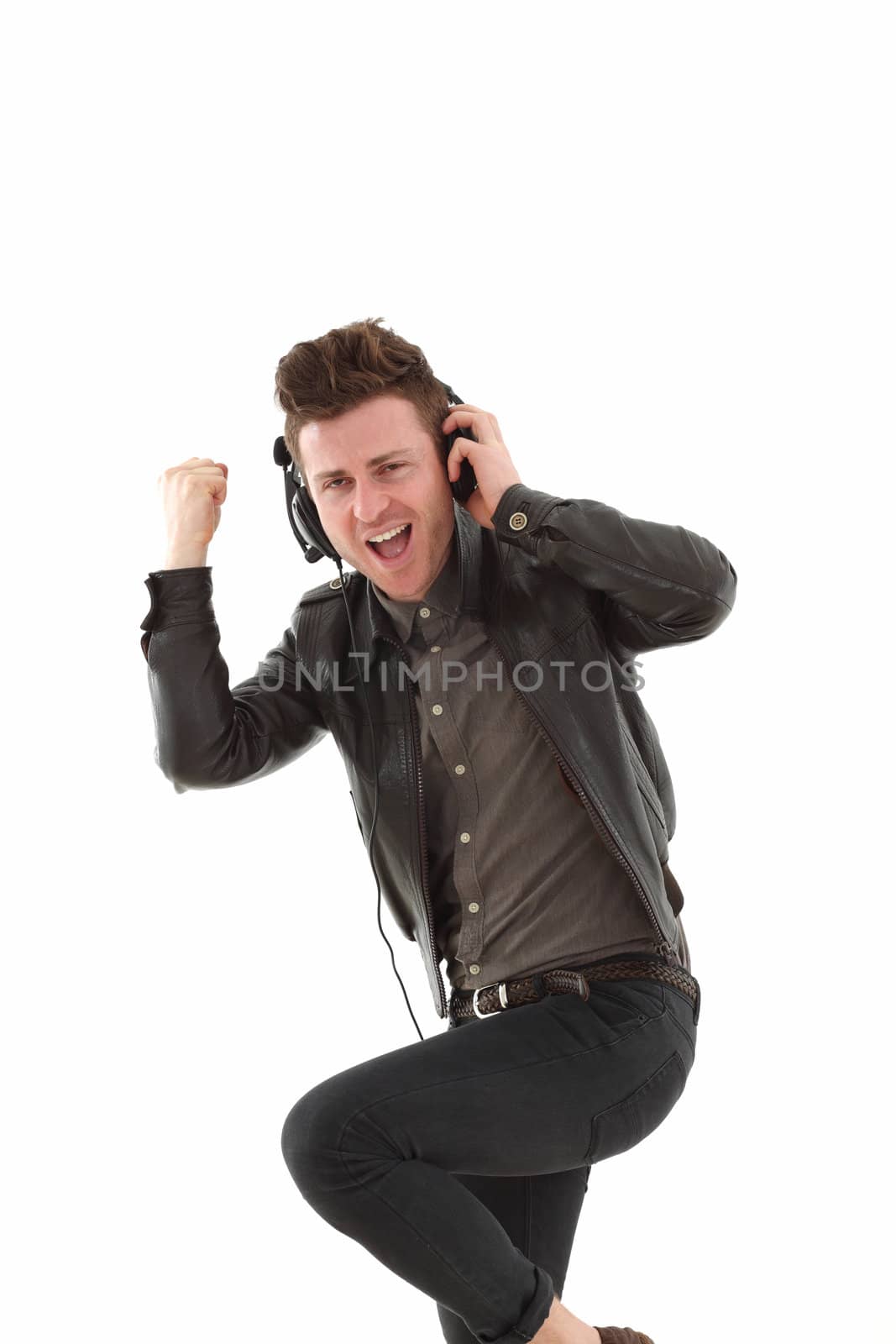 Young adult male with headset listening music isolated on white background