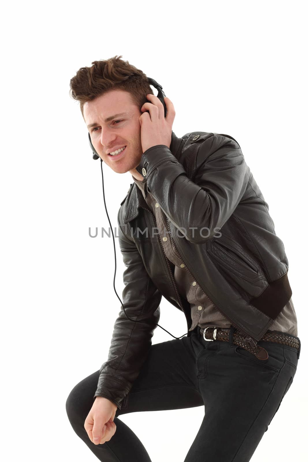 Young adult male listening music by shamtor