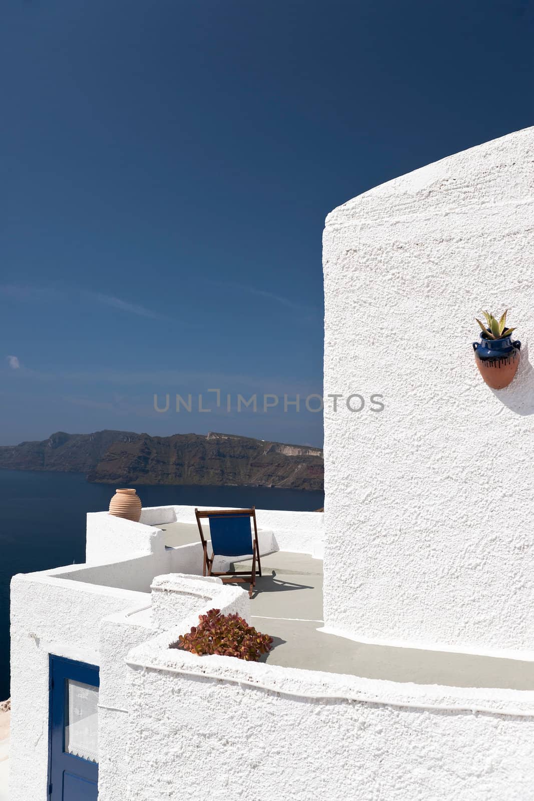 Whitewashed building with decoration and the island
