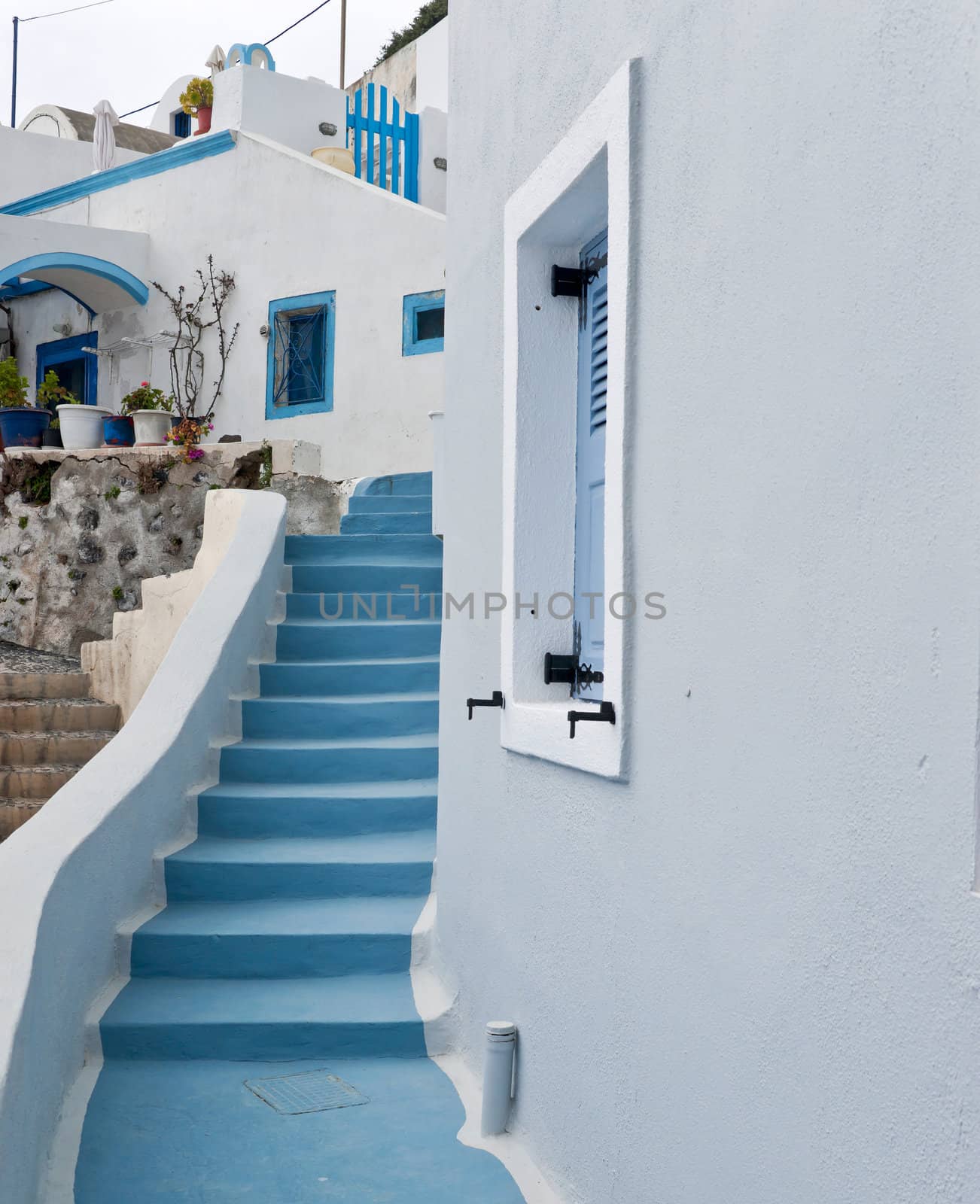 White buildings and blue staircase in Imerovigli village