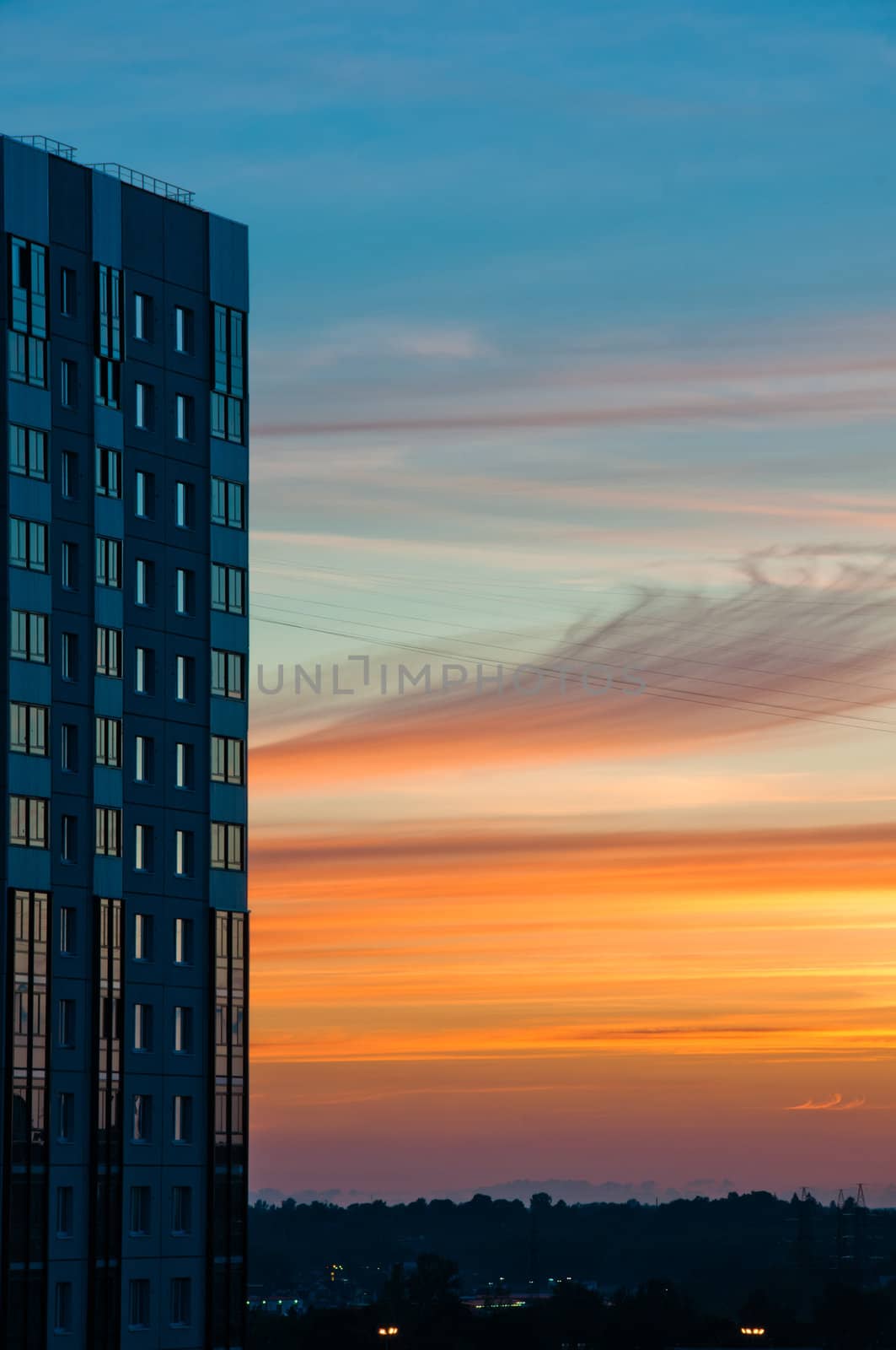 Modern building at sunset with beautiful cloudscape at background