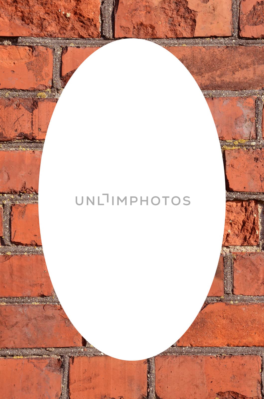 Fragment of old squared red brick wall. Isolated white oval place for text photograph image in center of frame.