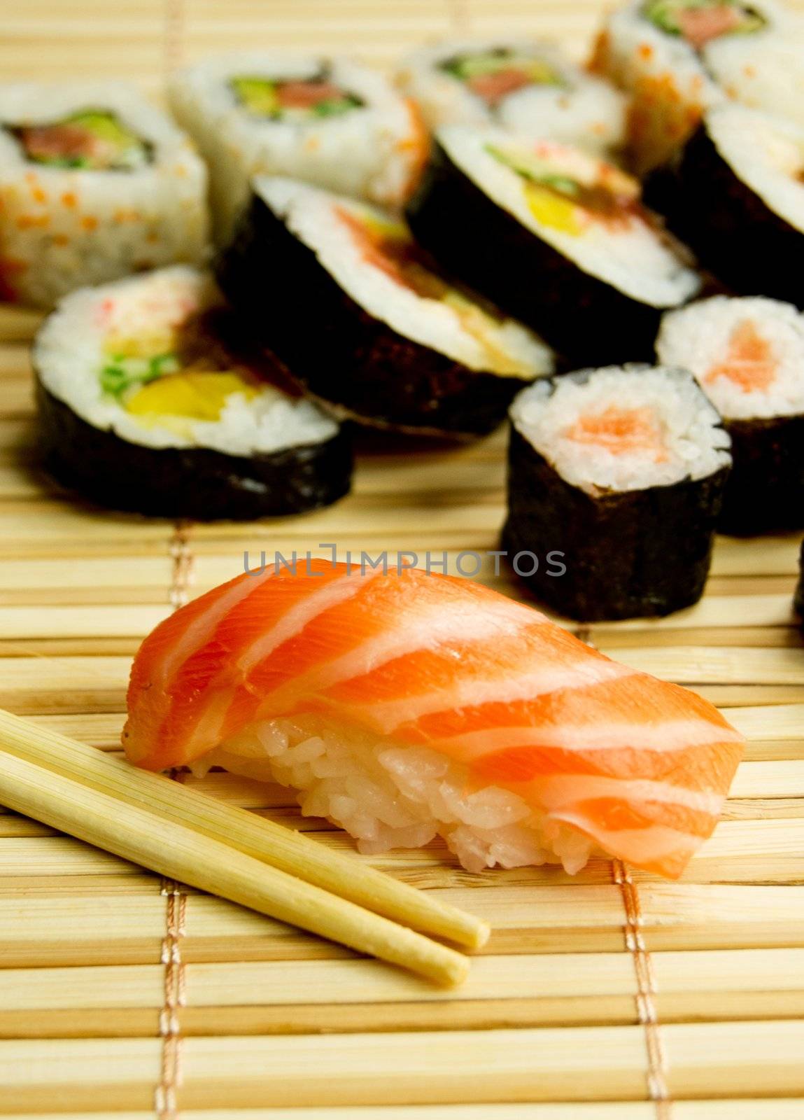 Japanese sushi set. Tuna, sticks on bamboo napkin