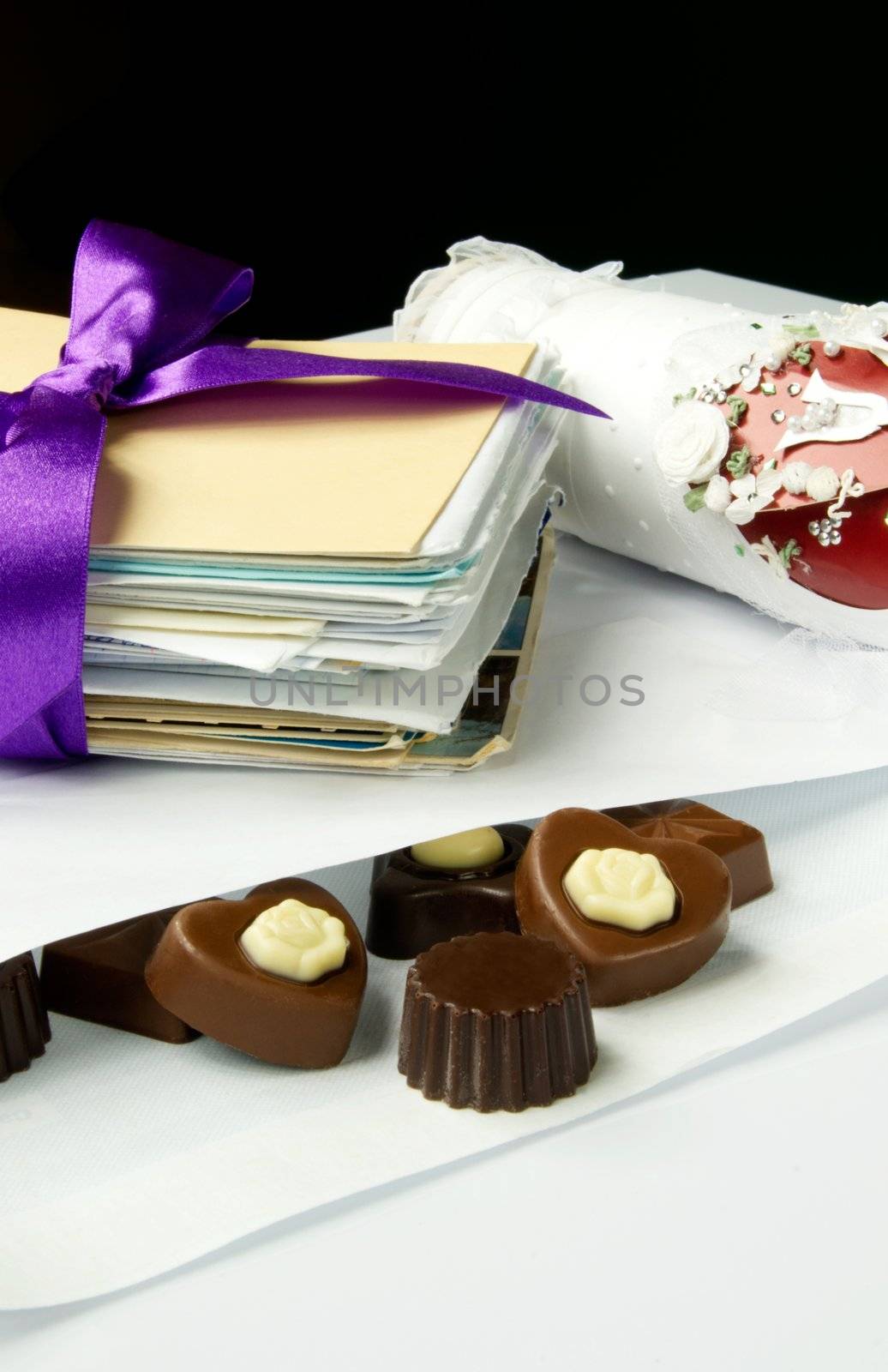 Sweet valentine mail. Chocolate composition with bow and letters