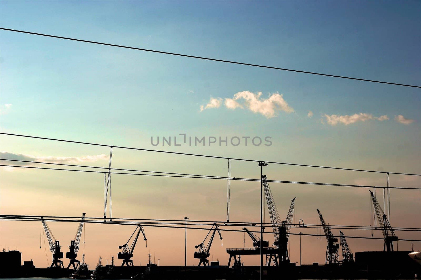 Powerful power station costing in an environment of snowdrifts on a background of the blue sky