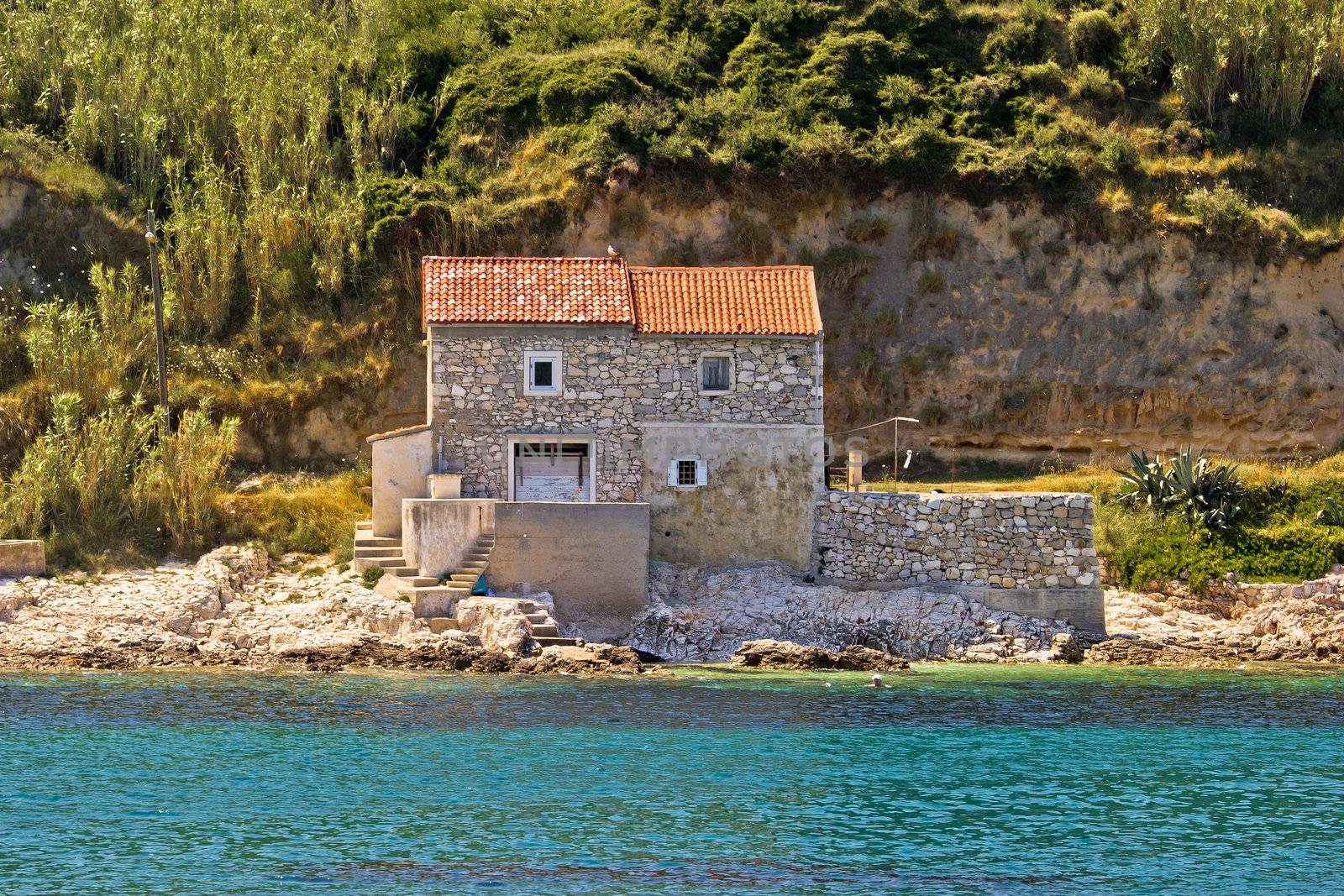 Stone house on the beach in dalmatian Island of Susak, Croatia