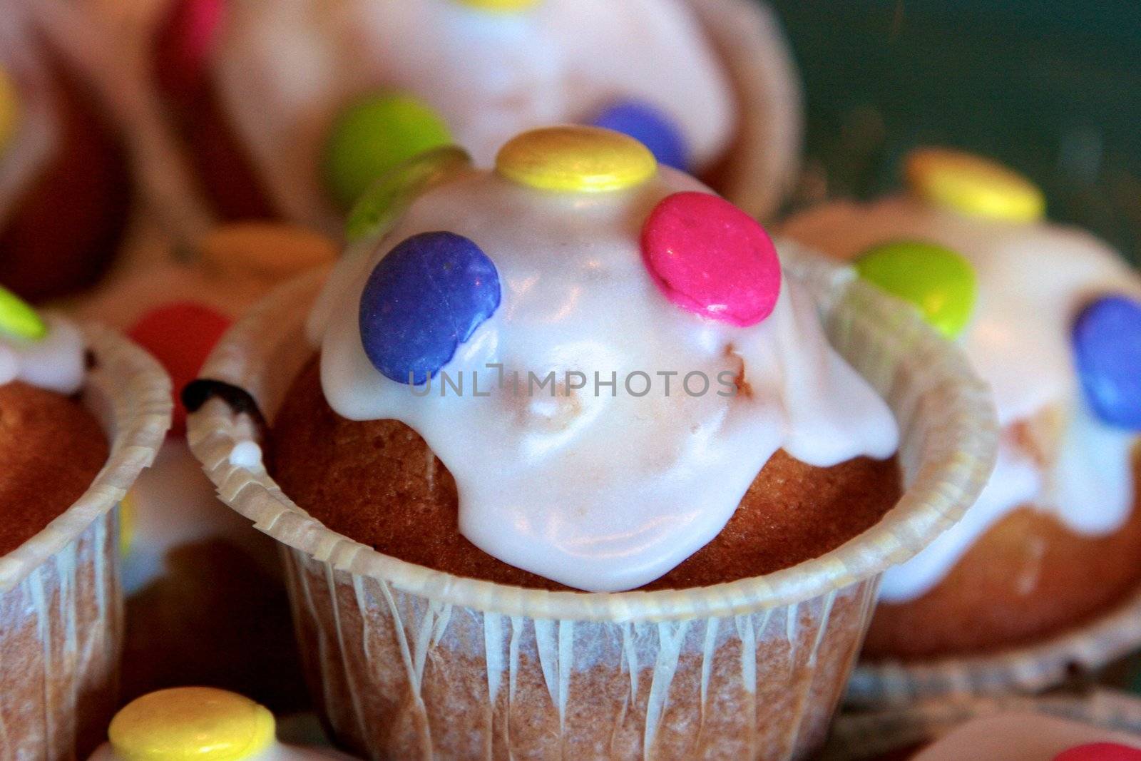 Cupcakes decorated with blue sugar flowers