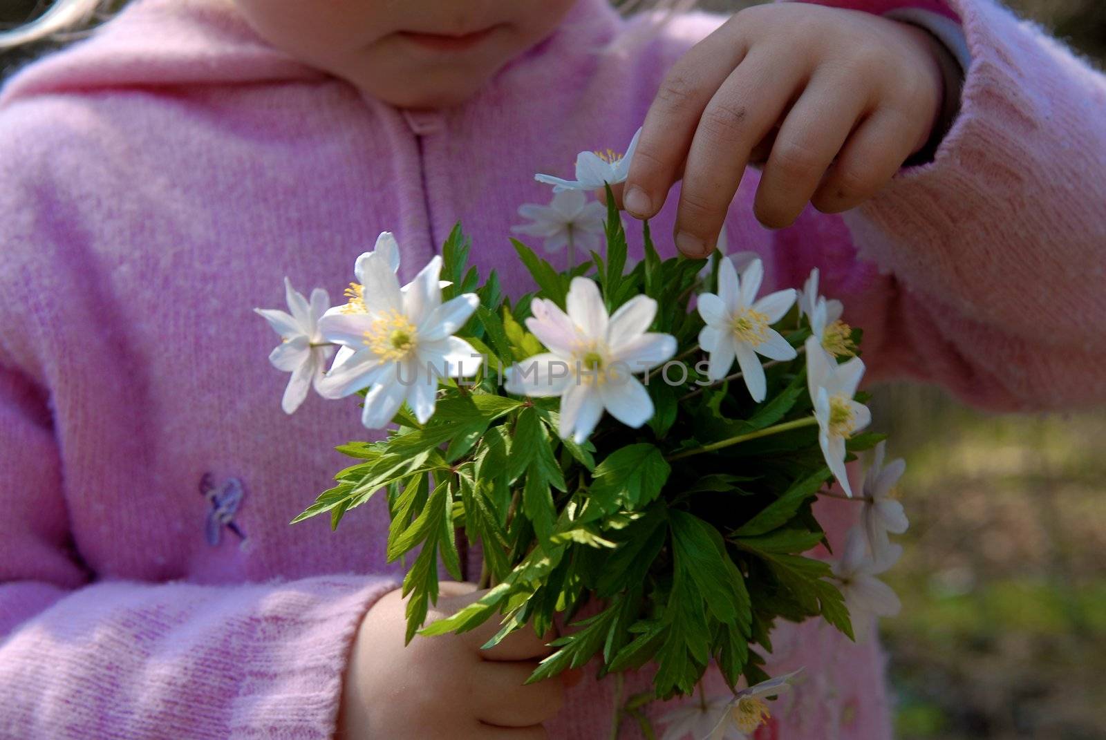 Cute girl with flower oudoors by Bildehagen