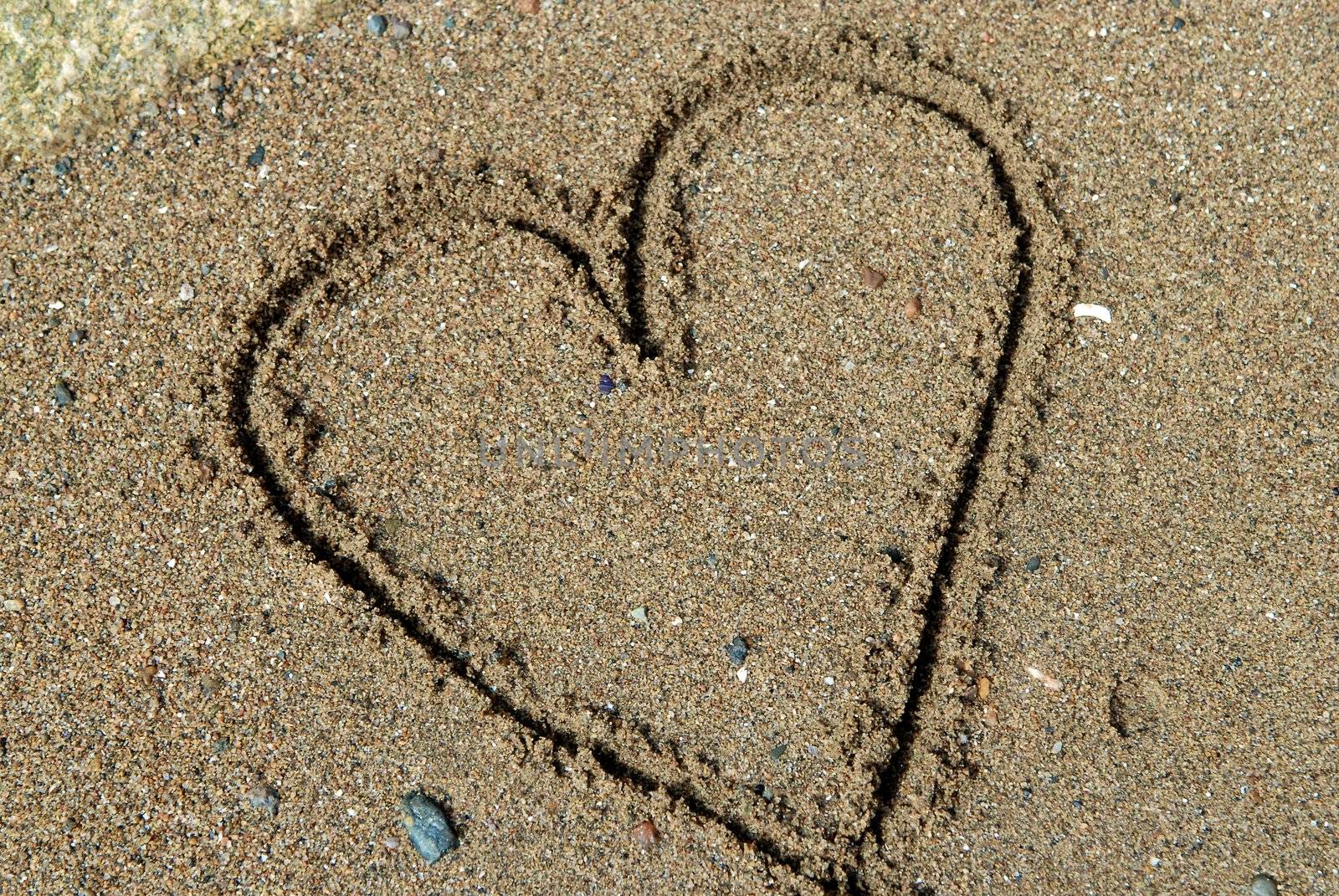 Heart on the sand beach by Bildehagen
