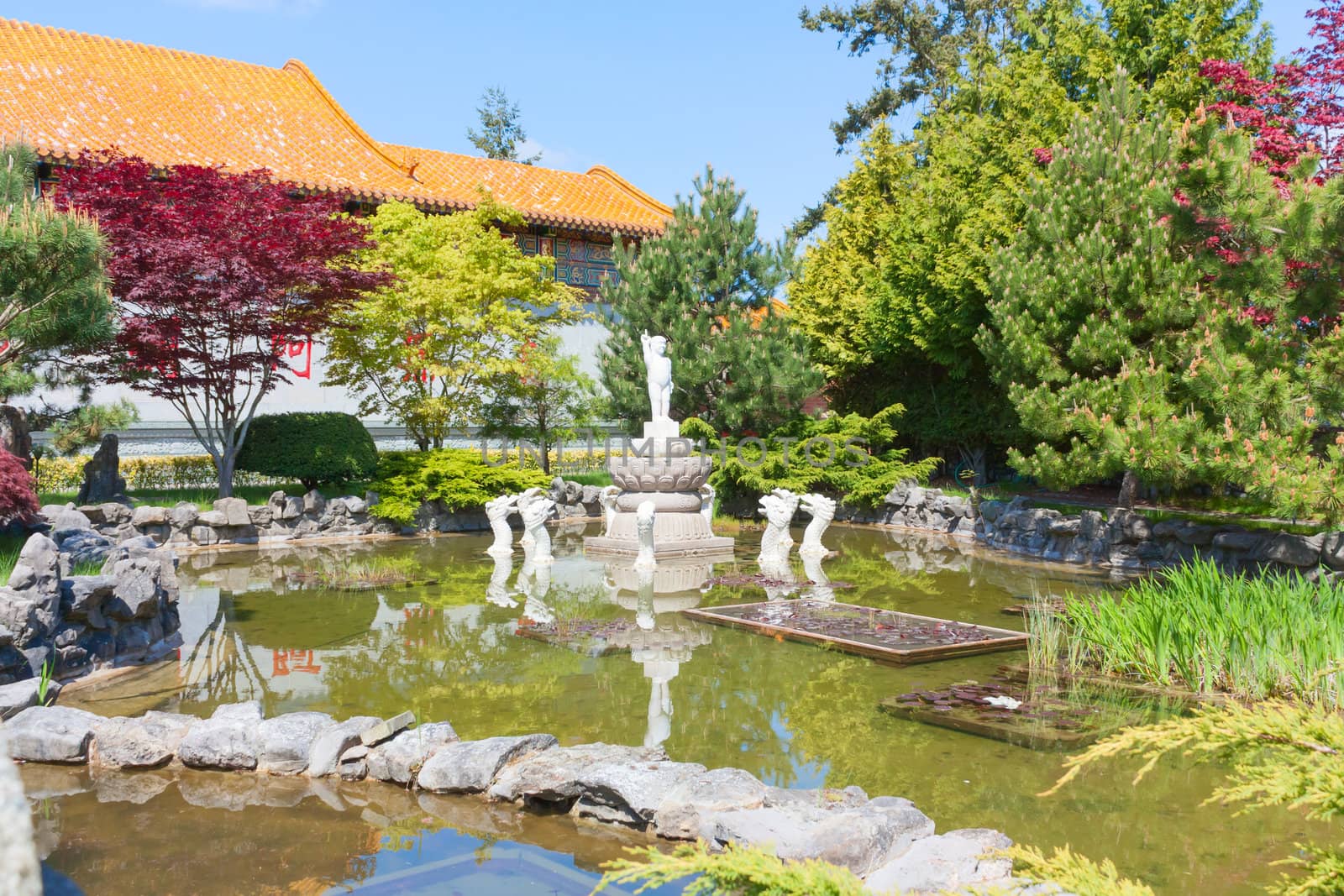 Pool and fountain in a Buddhist garden.