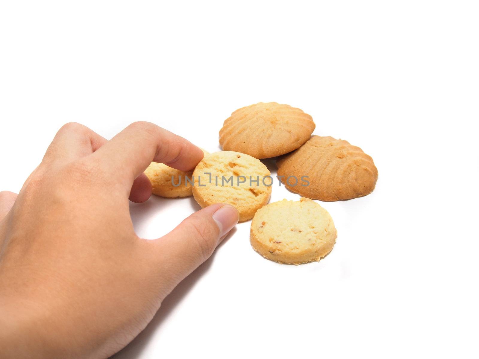 a hand about to get some  cookies isolated on a white background  