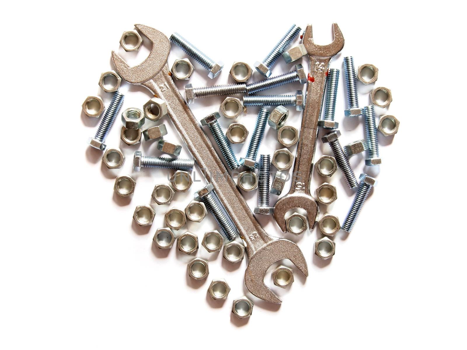 assorted wrench,nuts and bolts heart on white background by siraanamwong