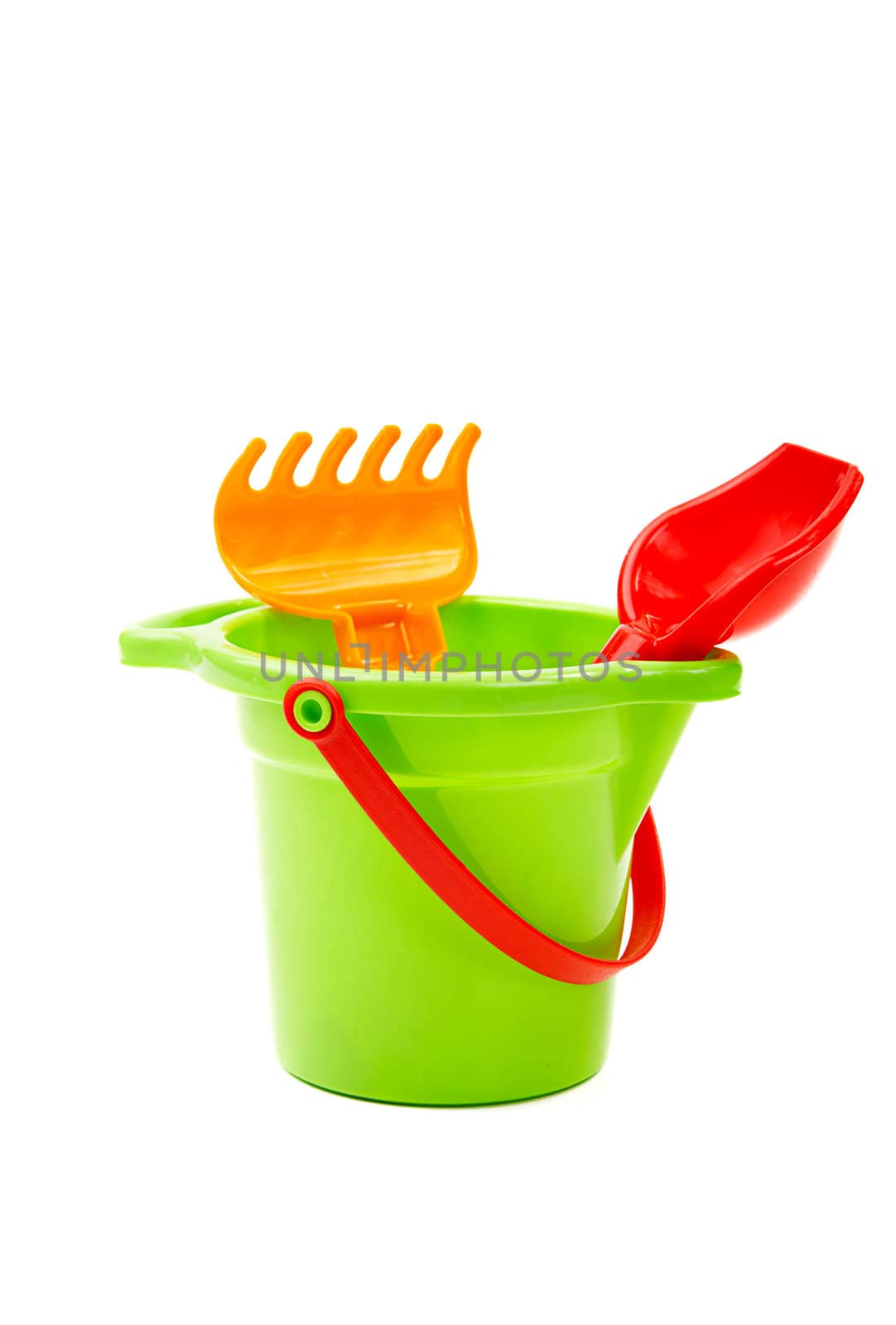 Children's toys  bucket  shovel and  rake on the white