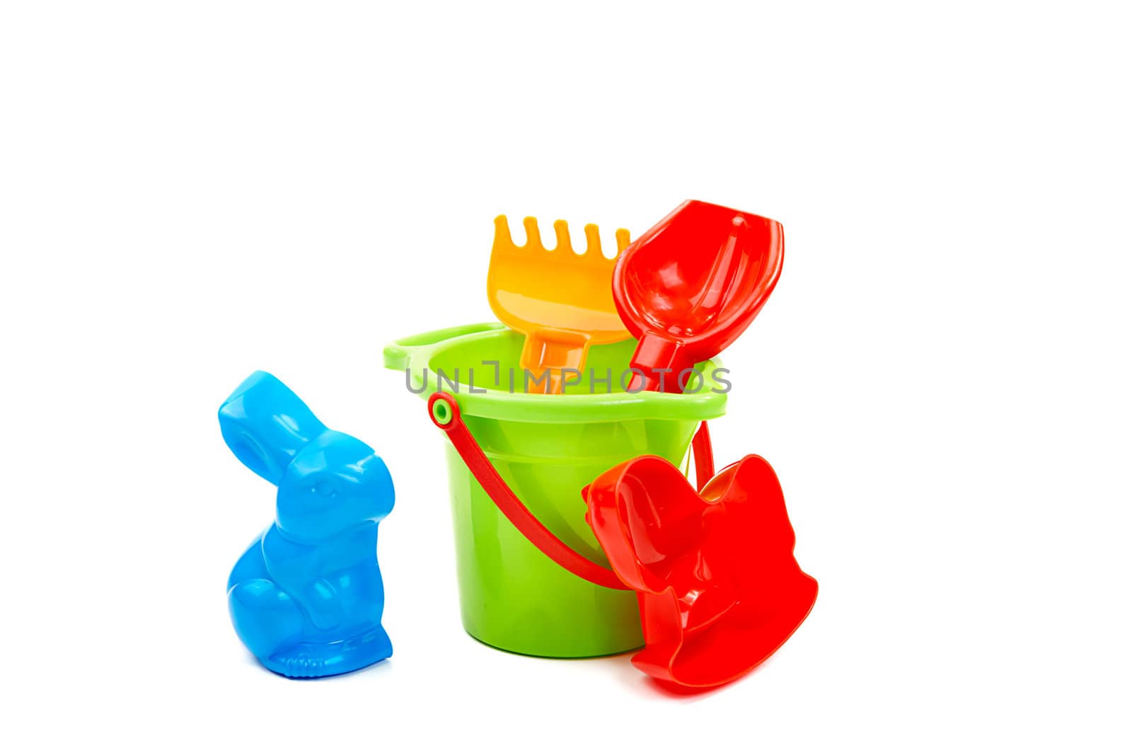 Children's toys  bucket  shovel and  rake on the white