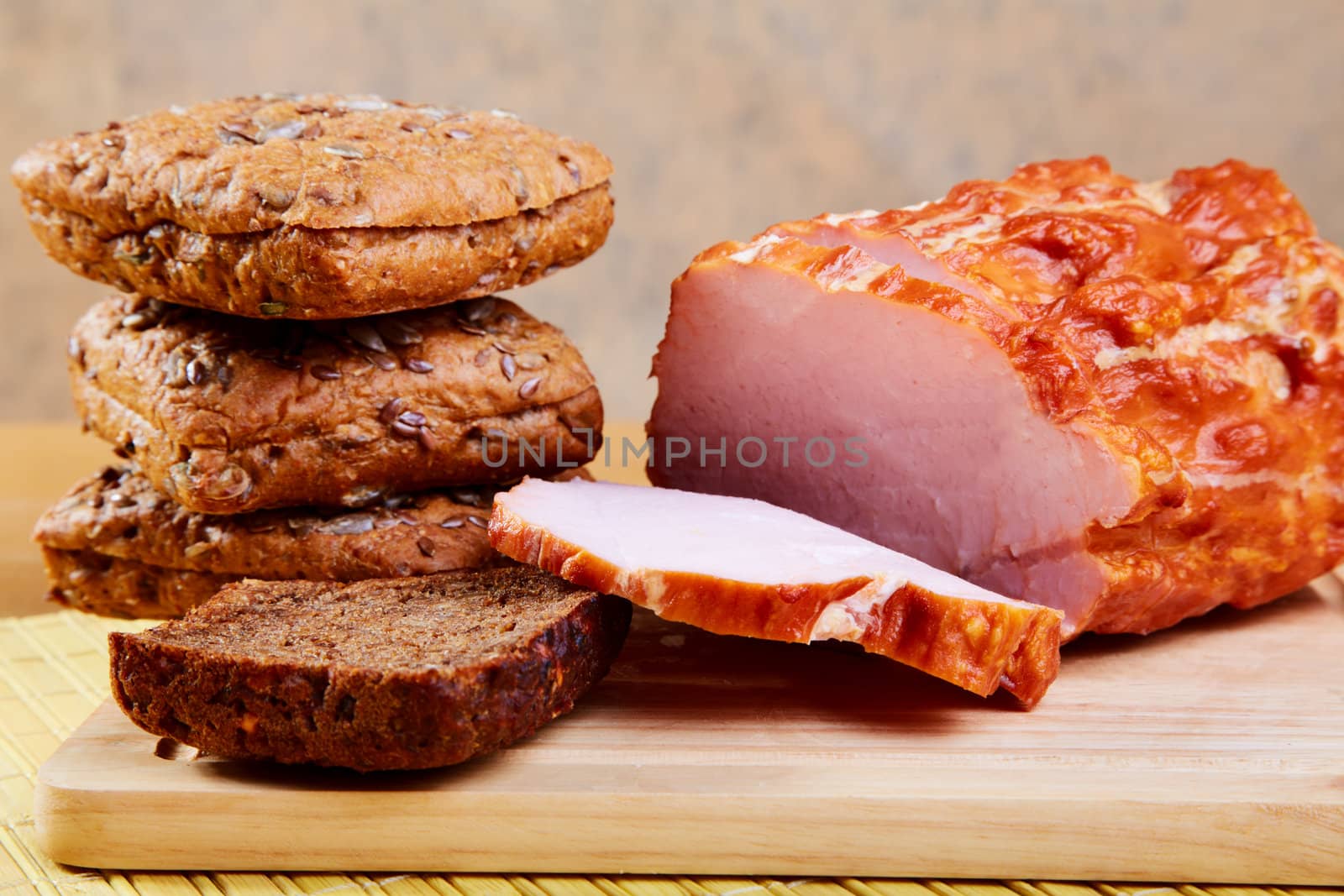 The sliced ham and bread slices